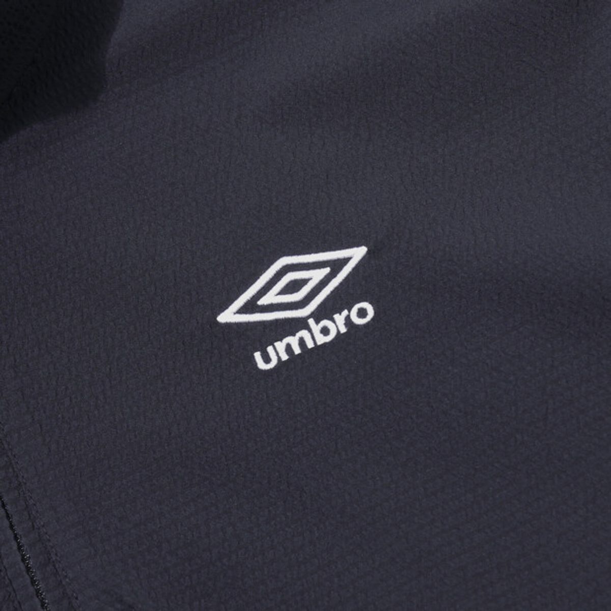 엄브로(UMBRO) 시어서커 반팔 스탠넥 아노락 네이비 UR221CWT63