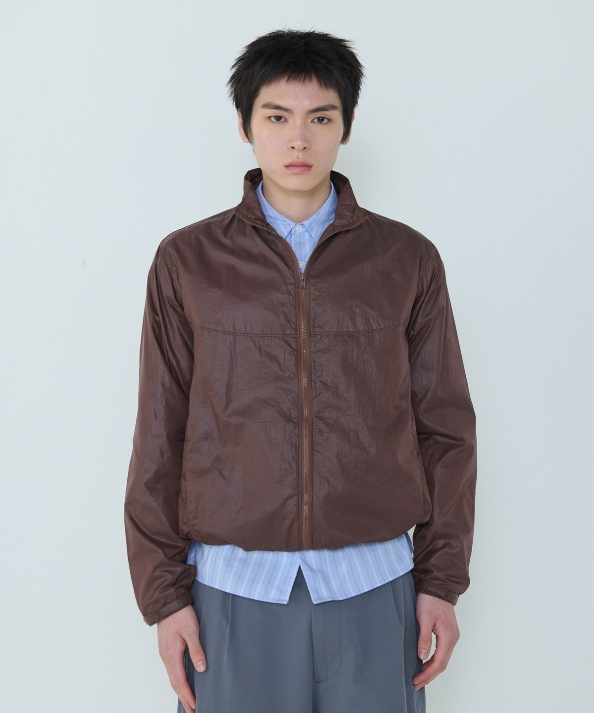 더씽인데어데어(THE THING IN THEIR THERE) Adaptive Nylon Jacket Brownie