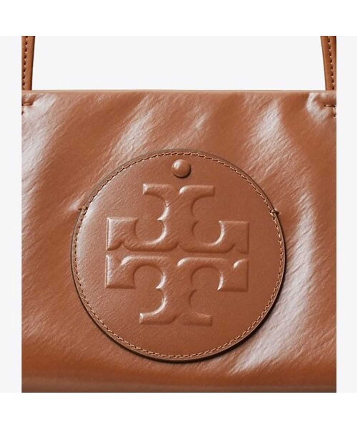 토리버치(TORYBURCH) 엘라 이스트웨스트 토트 - 에이지드 탄
