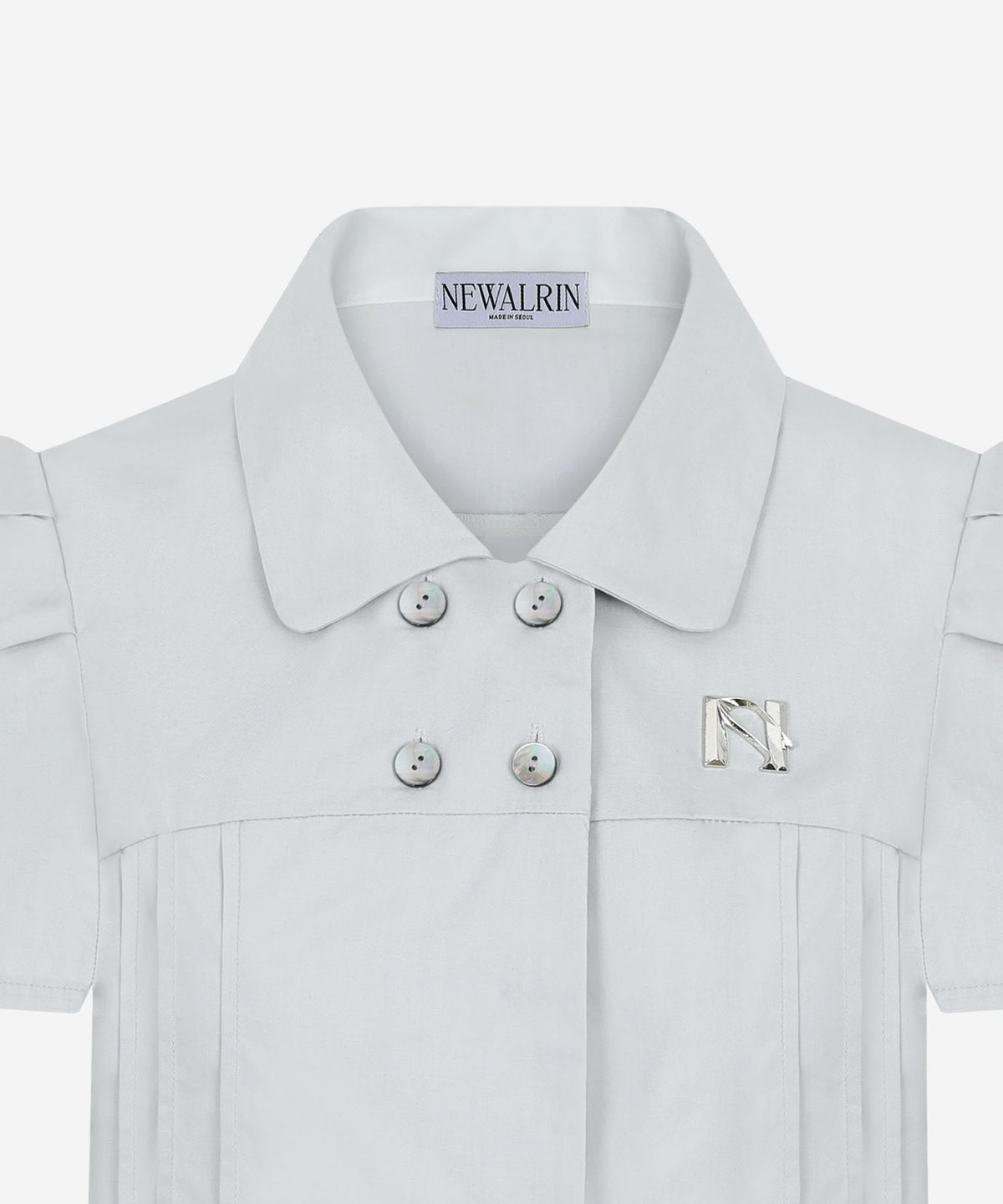 뉴얼린(NEWALRIN) NEWALRIN Emblem Pin tuck Shirt Top(3Colors)