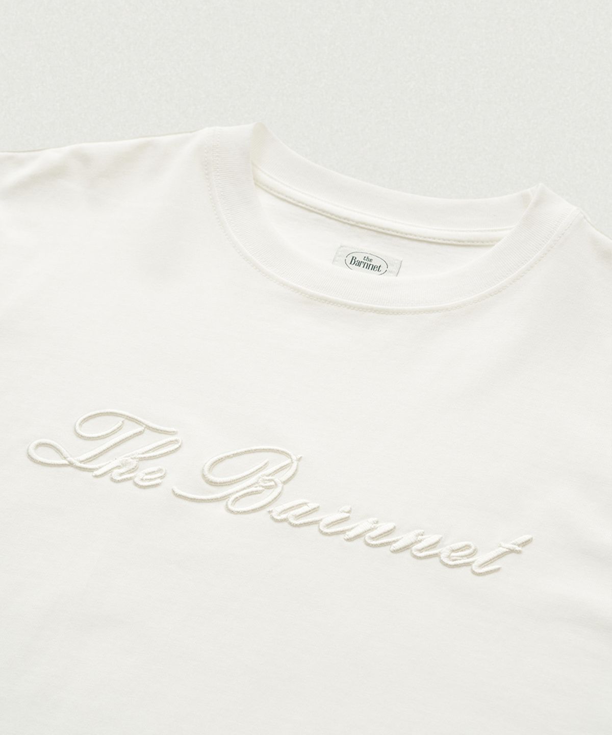 더바넷(THEBARNNET) Benny Script Logo T-shirt_White