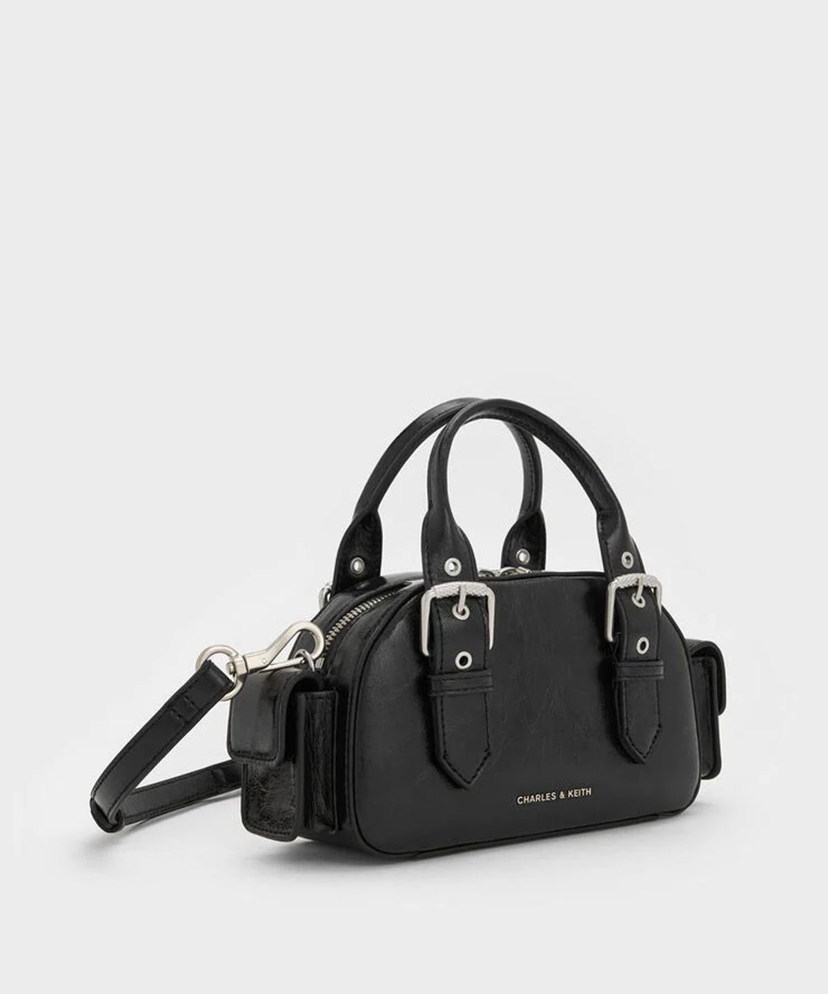 찰스앤키스(CHARLES & KEITH) 블레이즈 버클 스트랩 사이드 포켓 볼링백 2colors CK2-30770735