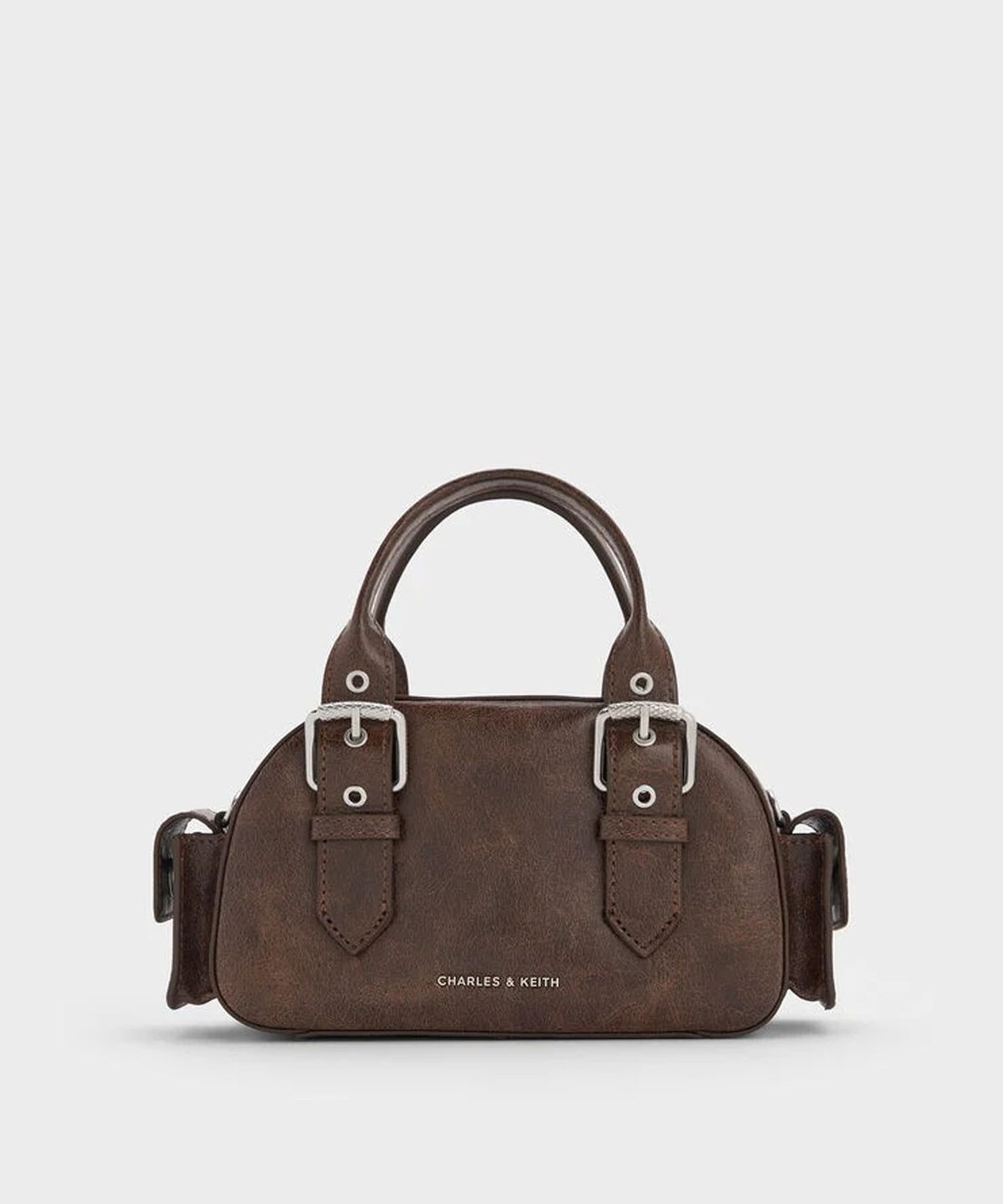찰스앤키스(CHARLES & KEITH) 블레이즈 버클 스트랩 사이드 포켓 볼링백 2colors CK2-30770735