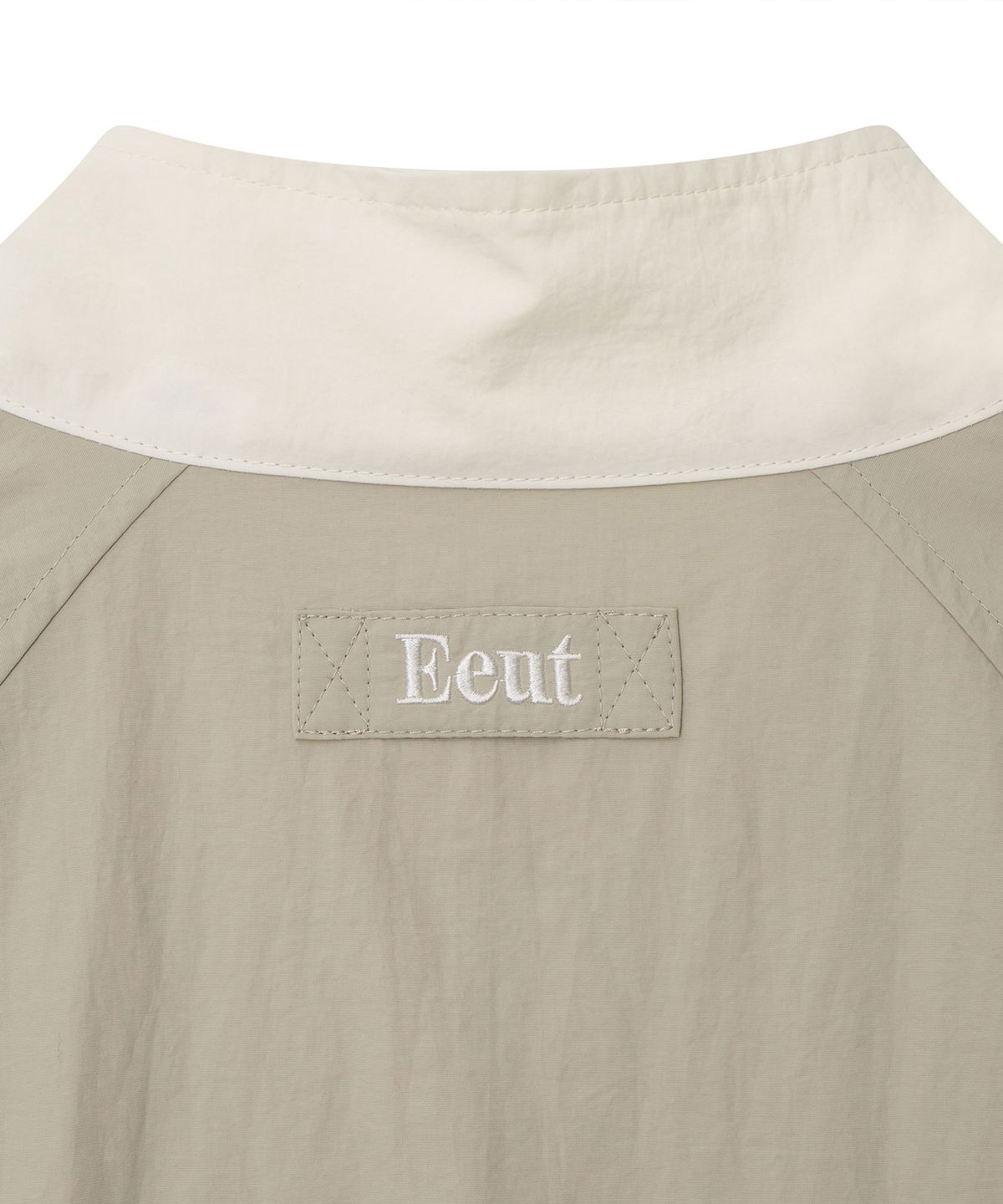 이우트(EEUT) ARCHIVE EMBROIDERED TRACK JUMPER / BEIGE