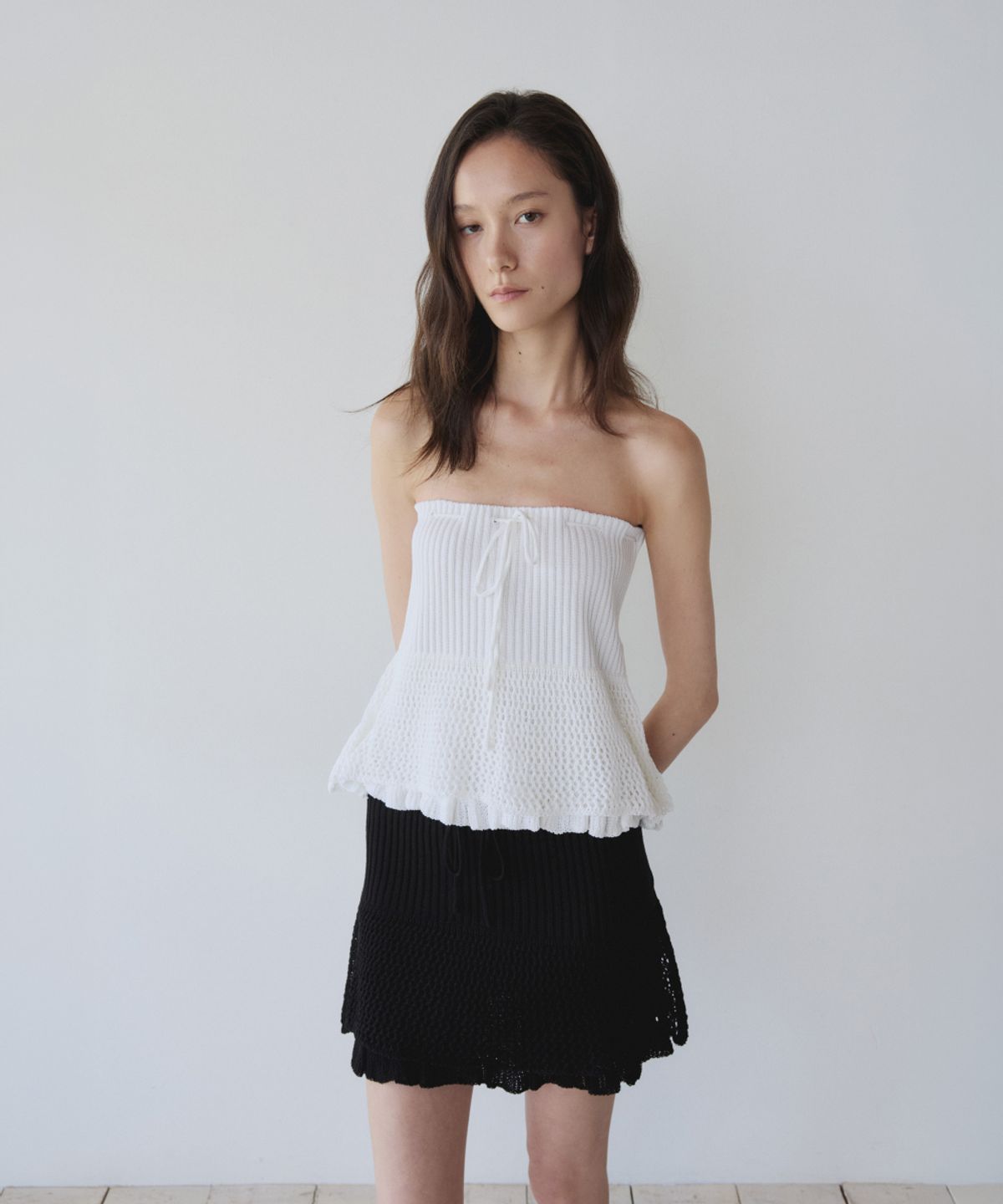 이어닝(YEARNING) LAYERED RUFFLE KNIT MINI SKIRT, BLACK