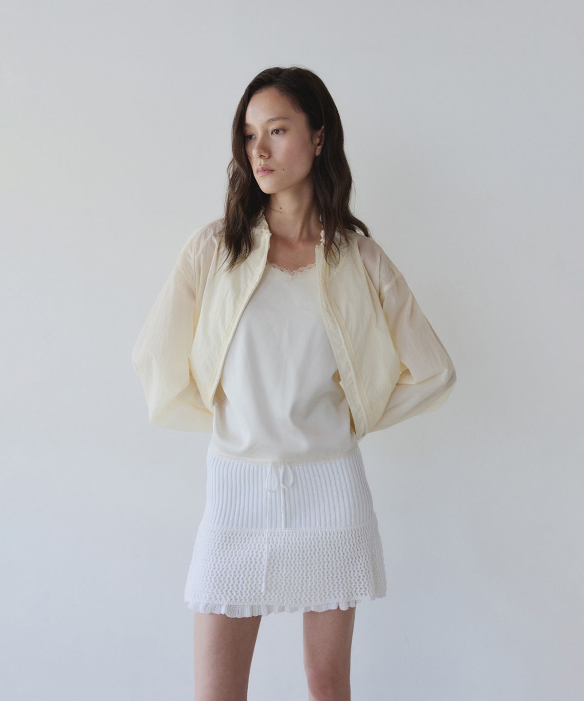 이어닝(YEARNING) LAYERED RUFFLE KNIT MINI SKIRT, IVORY