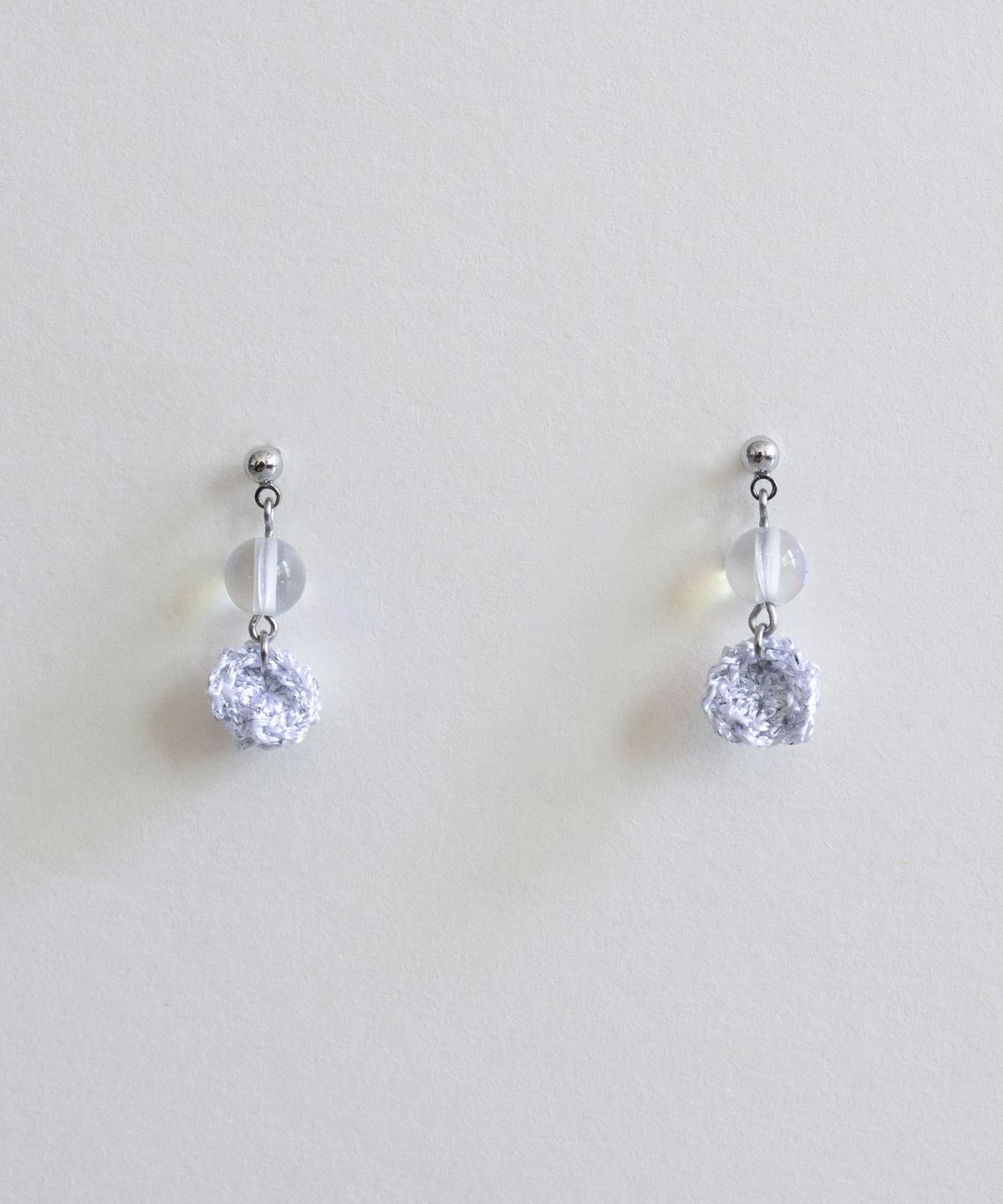 메리모티브(MERRYMOTIVE) Clear and silver drop earring