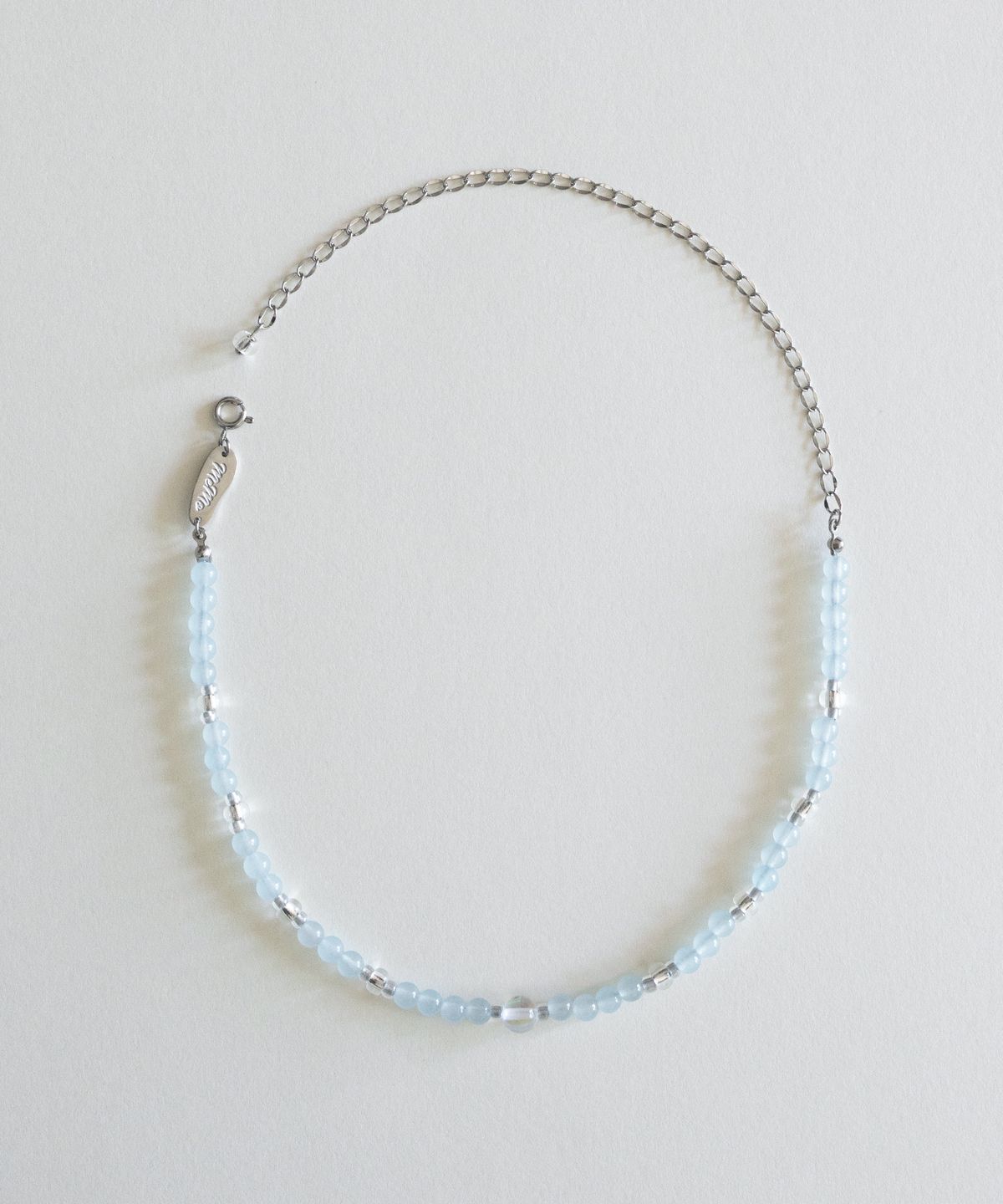 메리모티브(MERRYMOTIVE) Skyblue and clear gemstone necklace