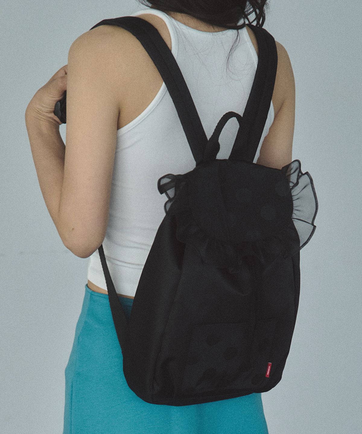 키미미(KIMIMI) 프릴 도트 스트링 백팩 블랙