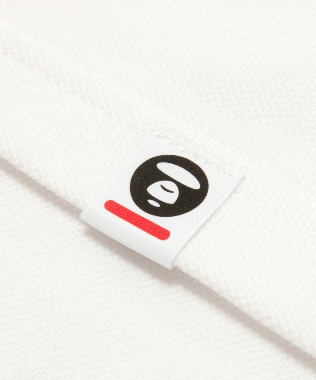 에이프(AAPE) AAPENOW 문페이스 로고 폴로 티셔츠 화이트 / AAPPOM1813XXQWHX