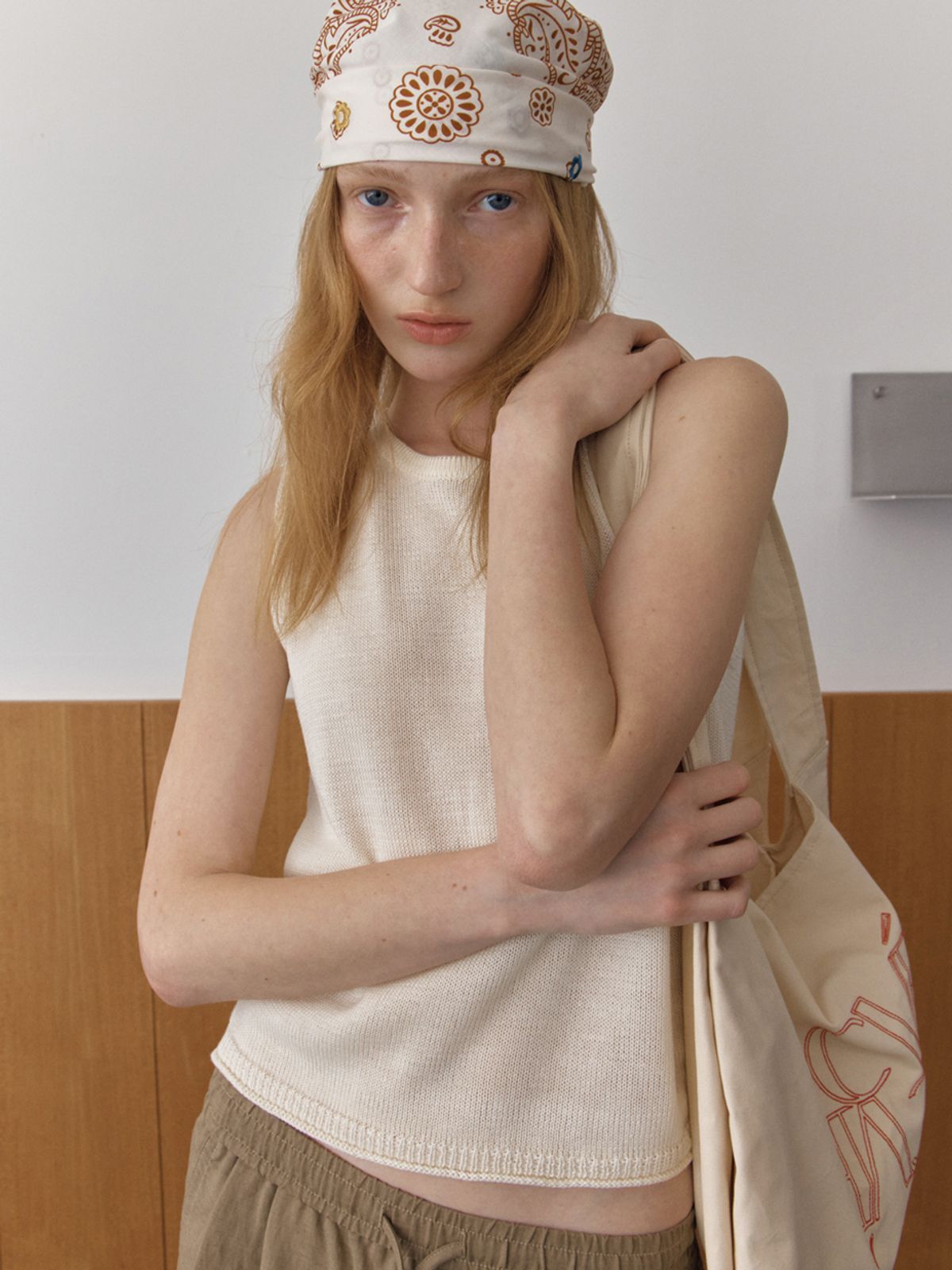 엘씨브이(LCVE) DIAGONAL BUTTONS SLEEVELESS KNIT_IVORY