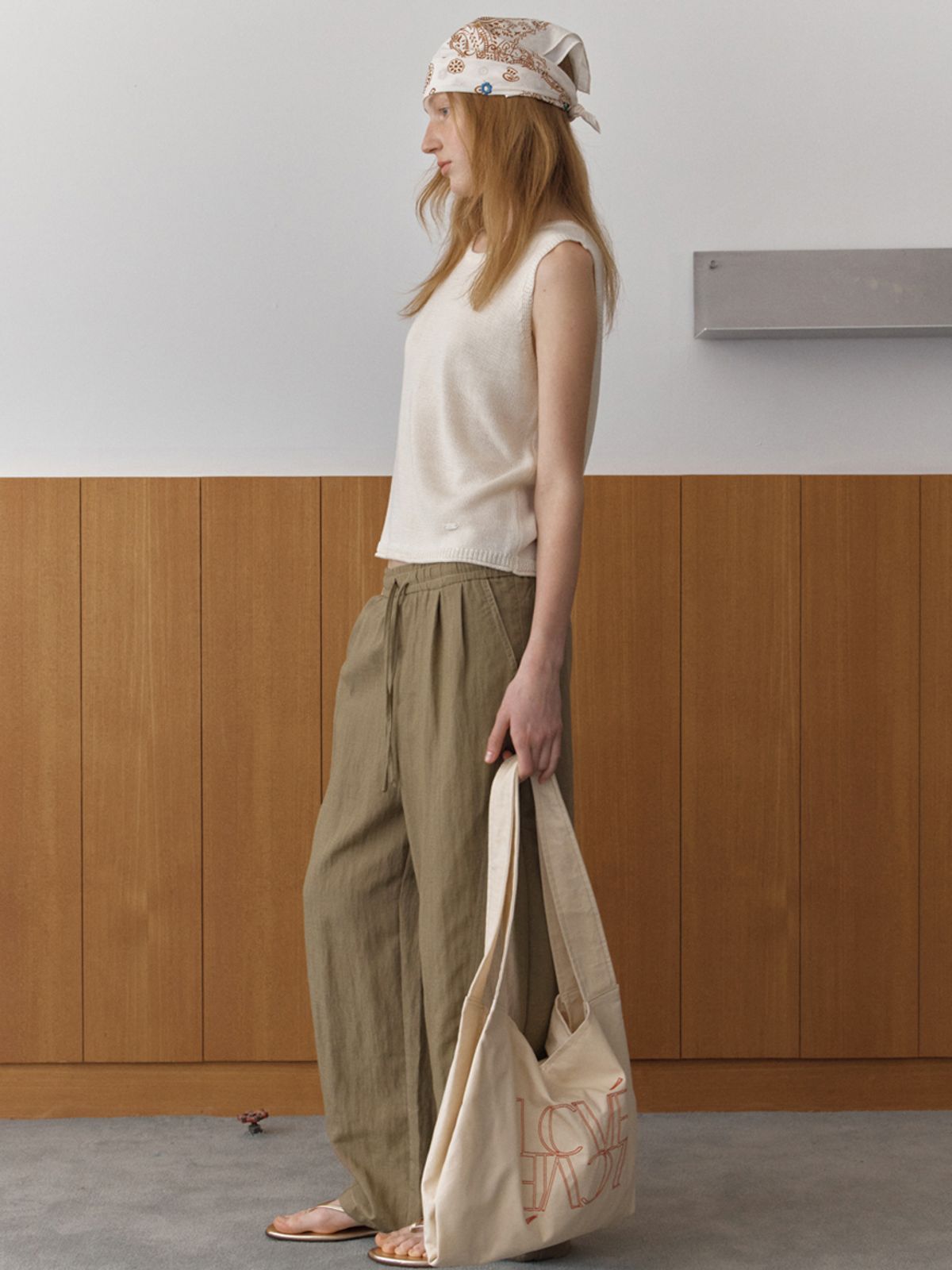 엘씨브이(LCVE) DIAGONAL BUTTONS SLEEVELESS KNIT_IVORY