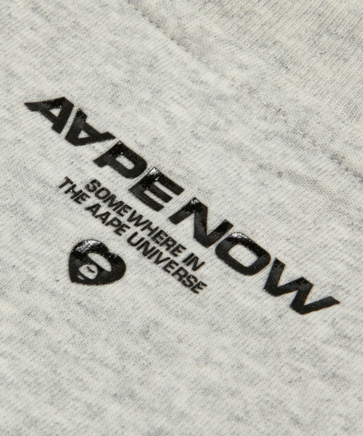 에이프(AAPE) AAPENOW 하트 문페이스 로고 티셔츠 라이트 그레이 / AAPTEM1807XAQWH2