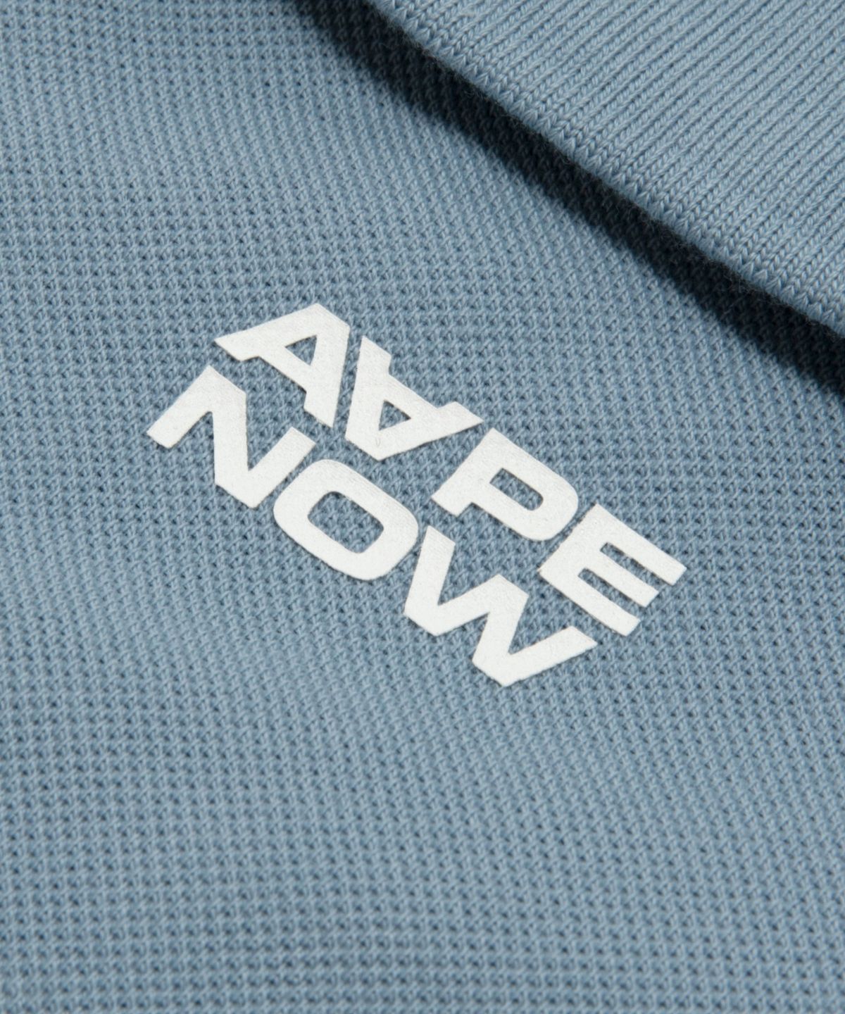 에이프(AAPE) AAPENOW 문페이스 로고 폴로 티셔츠 스카이 블루 / AAPPOM1813XXQBLE