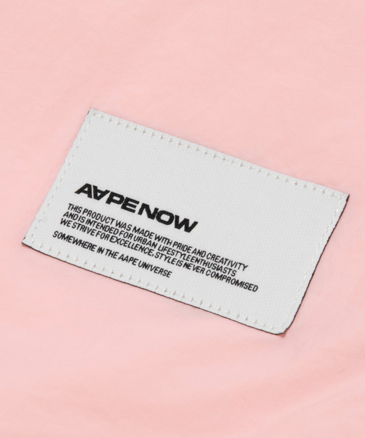 에이프(AAPE) AAPENOW 문페이스 윈드브레이커 핑크 / AAPLJM7770XXQPKL