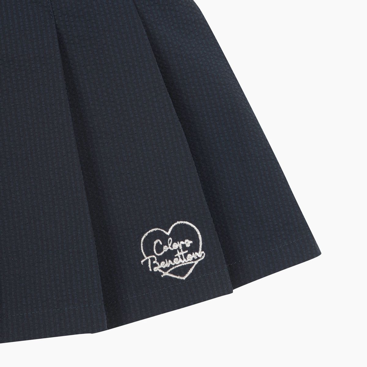 베네통키즈(BENETTONKIDS) [Online Exclusive] 시어서커 플리츠 스커트_QASK10631NY