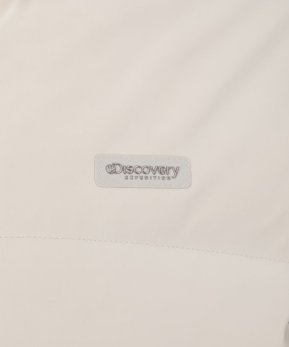 디스커버리 익스페디션(DISCOVERY EXPEDITION) 여성 뉴올리아 벨벳터치 다운 숏패딩 (IVORY)