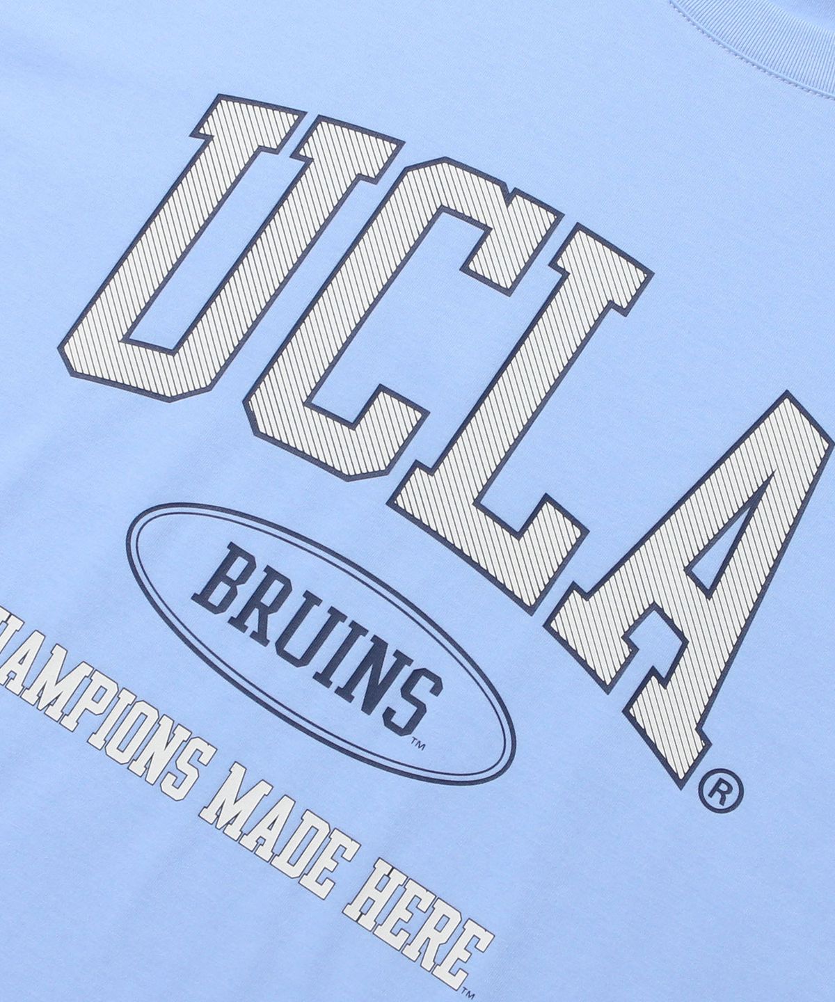 유씨엘에이(UCLA) 남녀공용 UCLA 사선 아치 로고 아트웍 오버핏 반팔 티셔츠[SKY BLUE](UC6ST94)