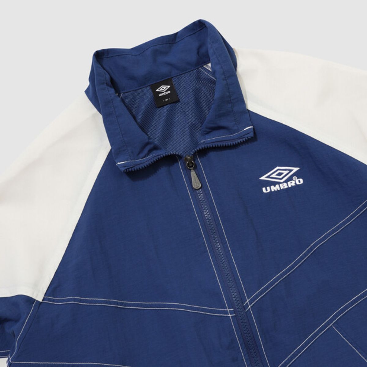 엄브로(UMBRO) 크리스피 타슬란 긴팔 자켓 블루 UR324CJK91