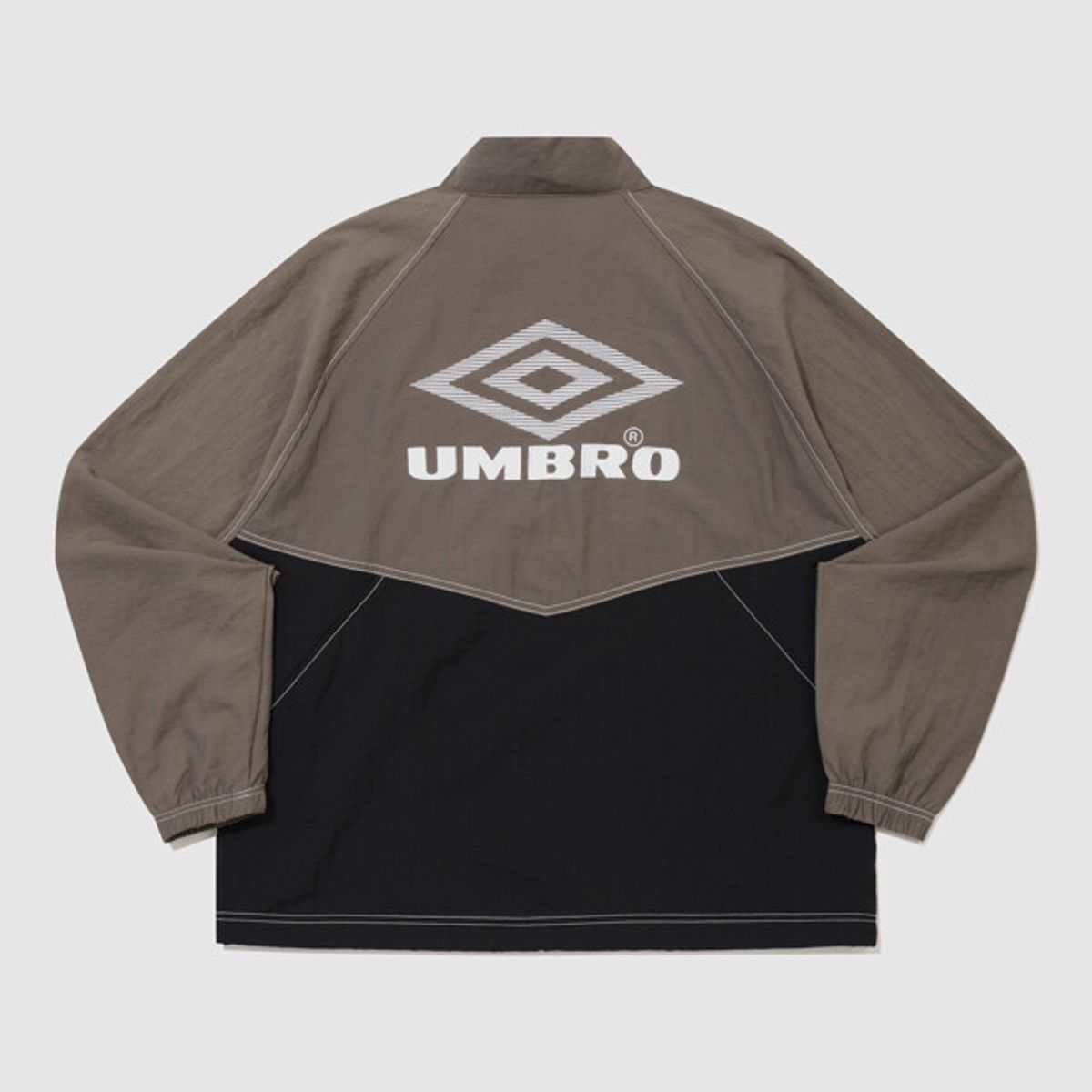 엄브로(UMBRO) 크리스피 타슬란 긴팔 스탠넥 아노락 브라운 UR324CWT91