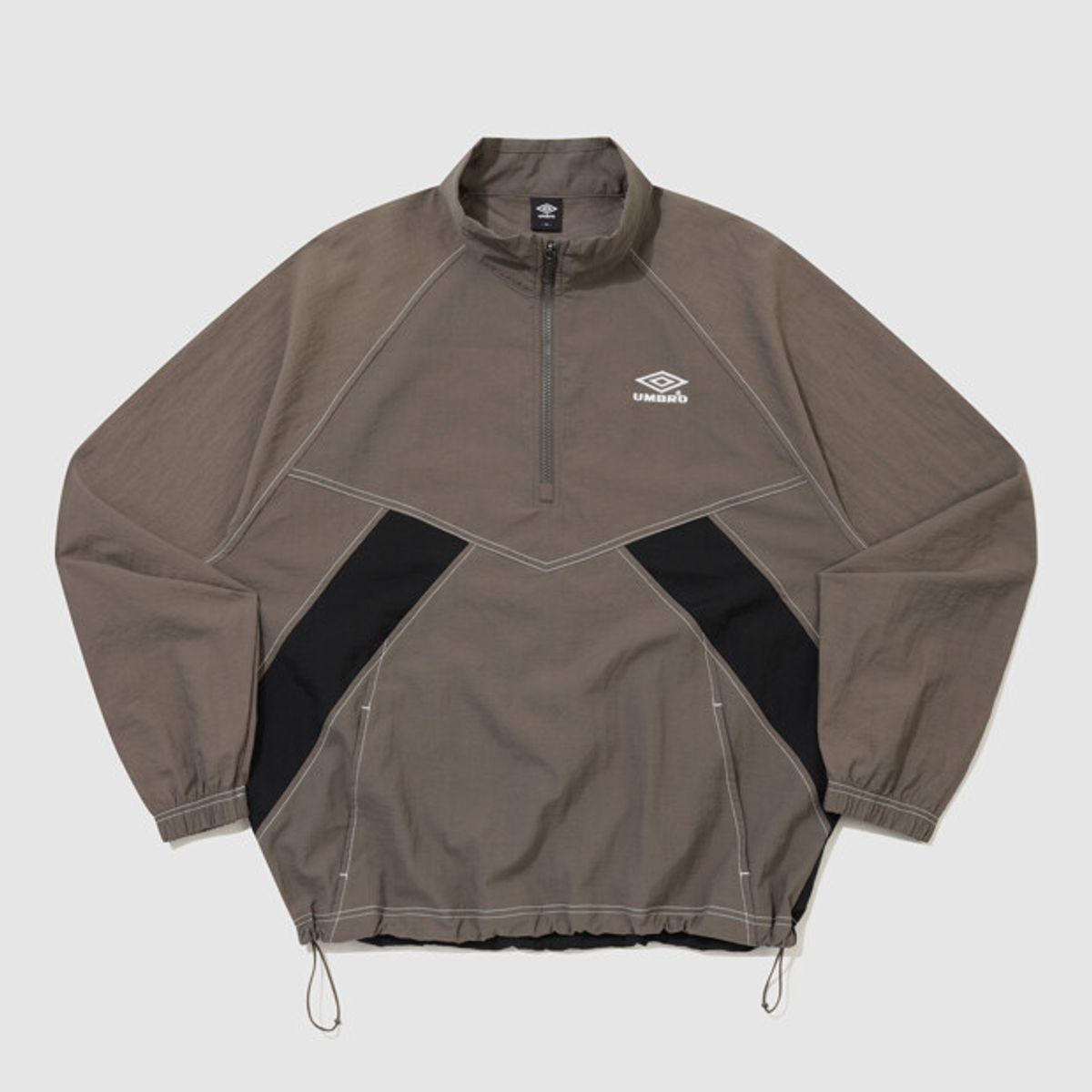 엄브로(UMBRO) 크리스피 타슬란 긴팔 스탠넥 아노락 브라운 UR324CWT91