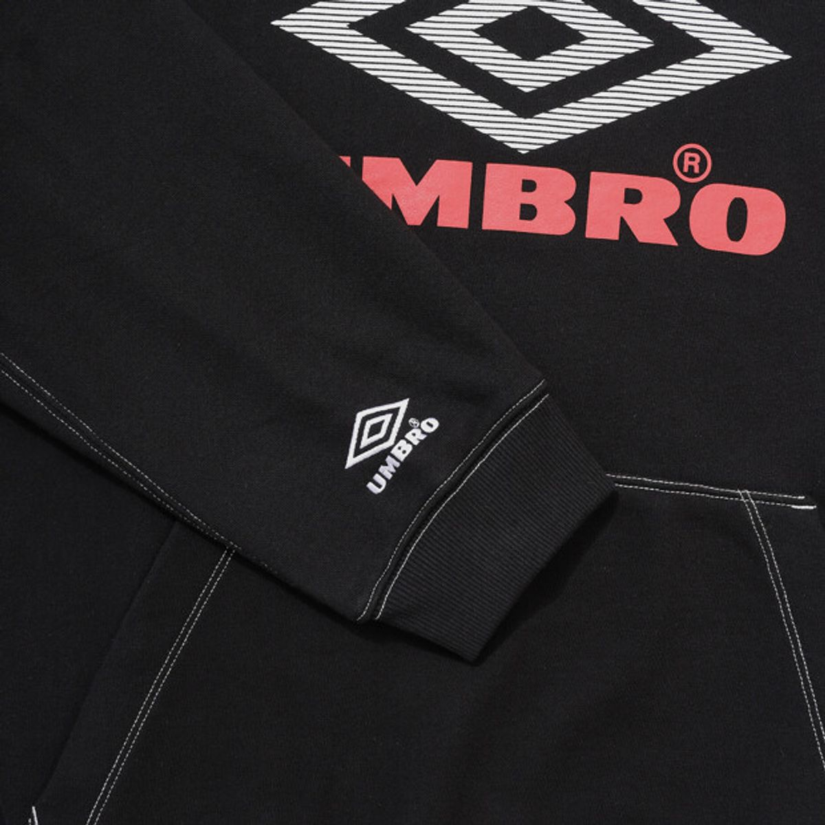 엄브로(UMBRO) 크리스피 타슬란 솔리드 후드 티셔츠 블랙 UR321CHD96
