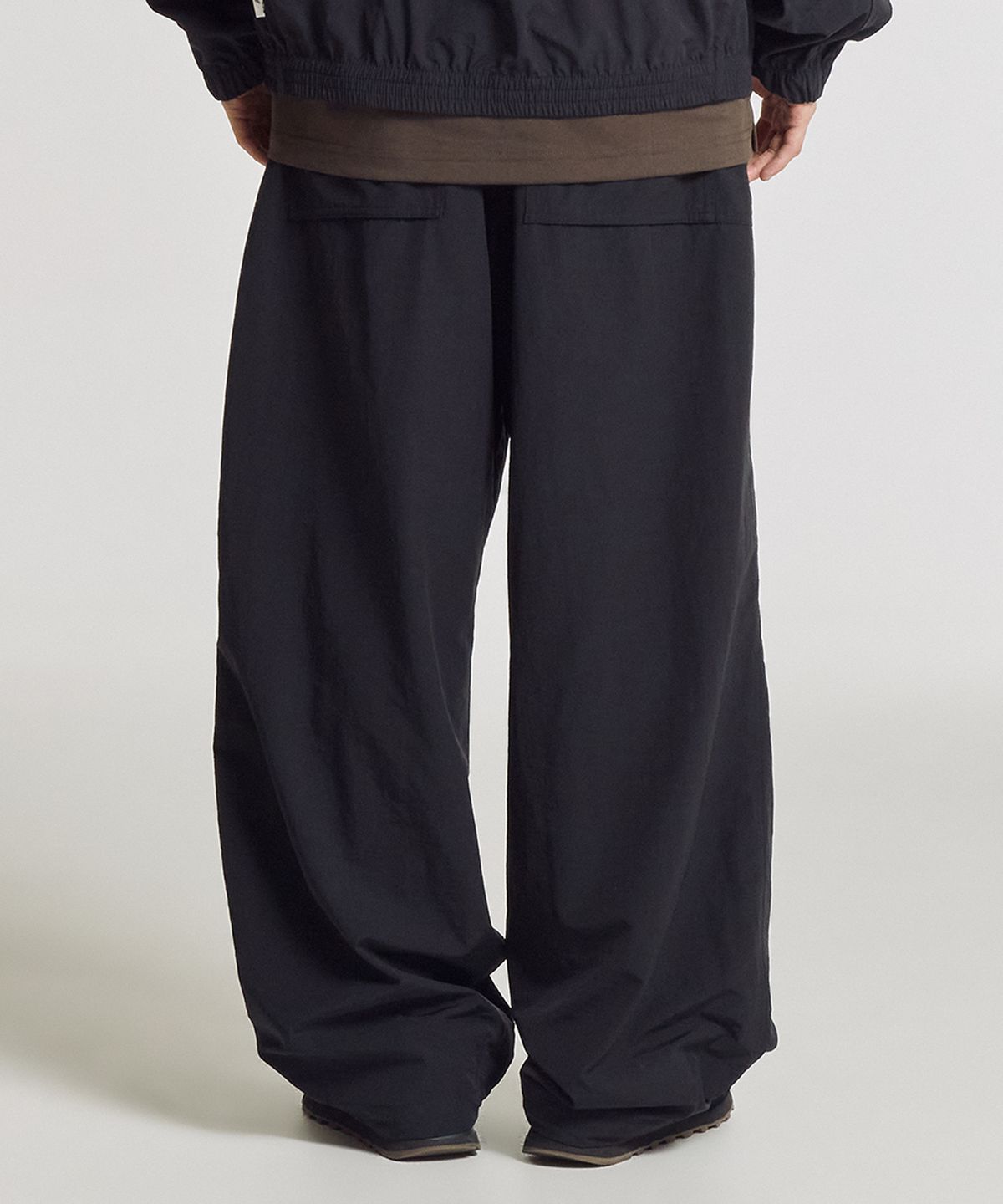 뉴발란스(NEW BALANCE) NBNTG31803 / UNI 에센셜 헤리티지 2WAY 우븐 와이드 팬츠 (BLACK)