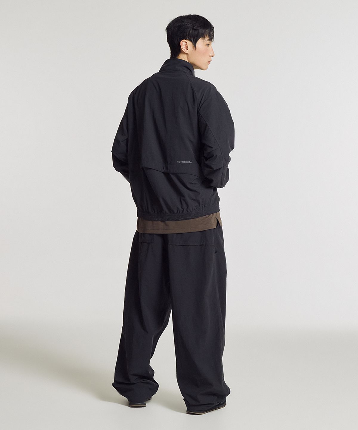뉴발란스(NEW BALANCE) NBNTG31803 / UNI 에센셜 헤리티지 2WAY 우븐 와이드 팬츠 (BLACK)