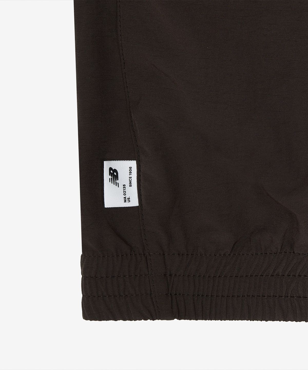 뉴발란스(NEW BALANCE) NBNAG31803 / UNI 에센셜 헤리티지 스탠드넥 웜업자켓 (BROWN)