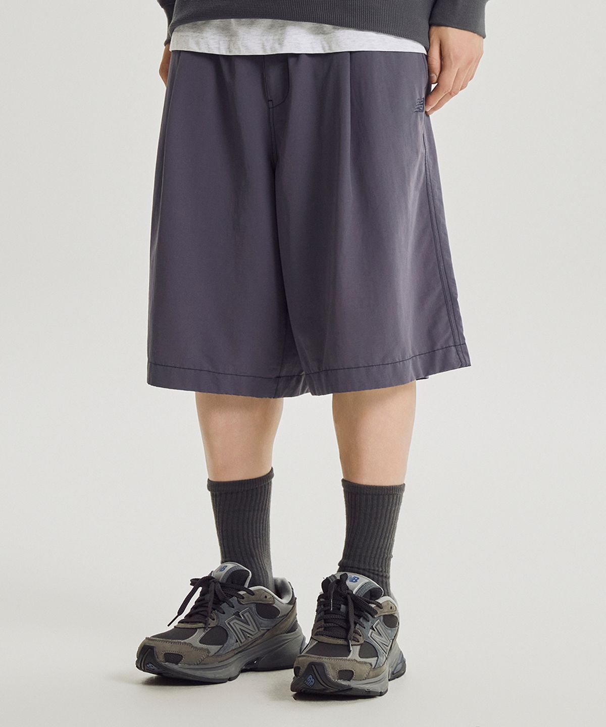 뉴발란스(NEW BALANCE) NBNVG31833 / UNI ESCAPE 6부 우븐 쇼츠 (PURPLE)