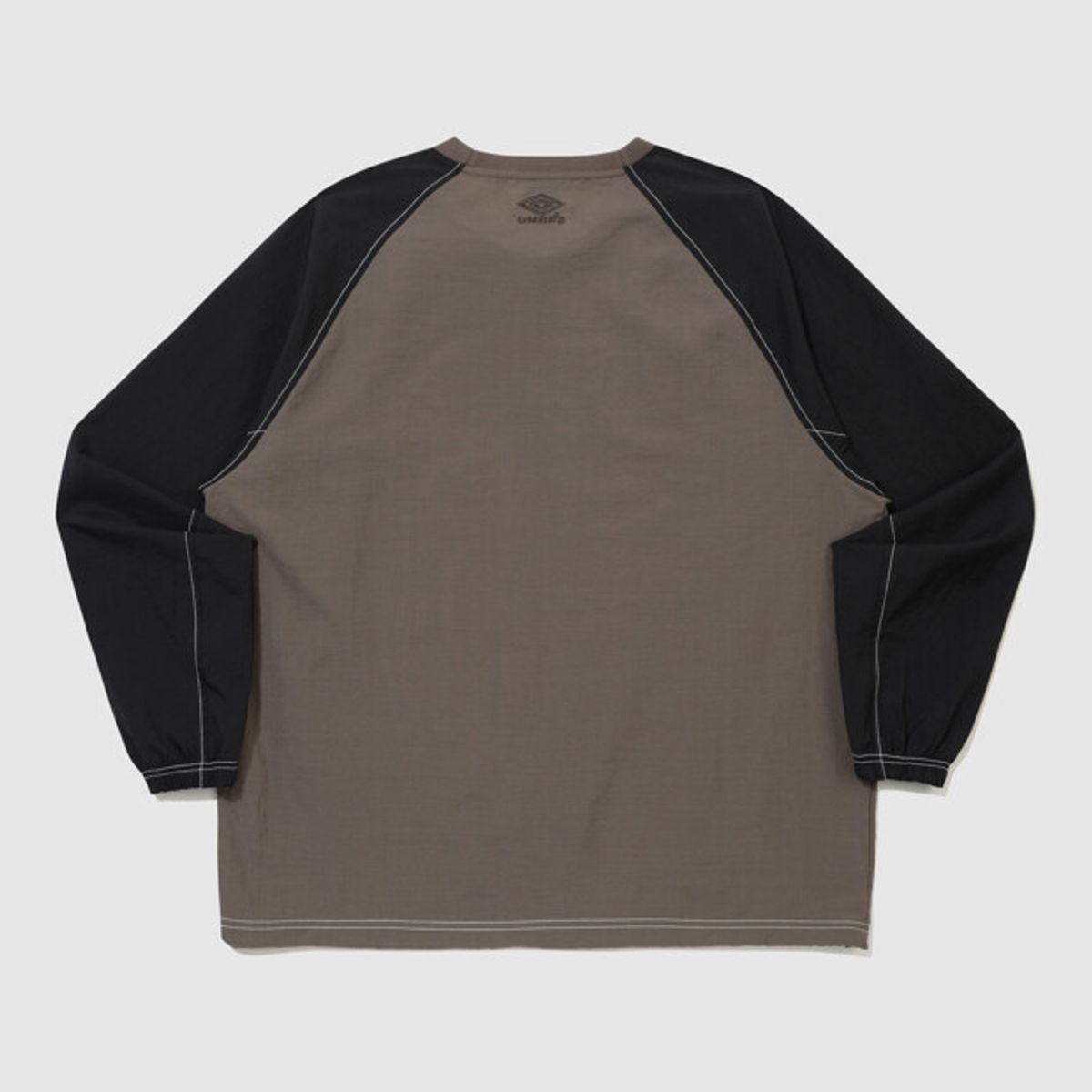 엄브로(UMBRO) 크리스피 타슬란 긴팔 피스테 브라운 UR324CWT92