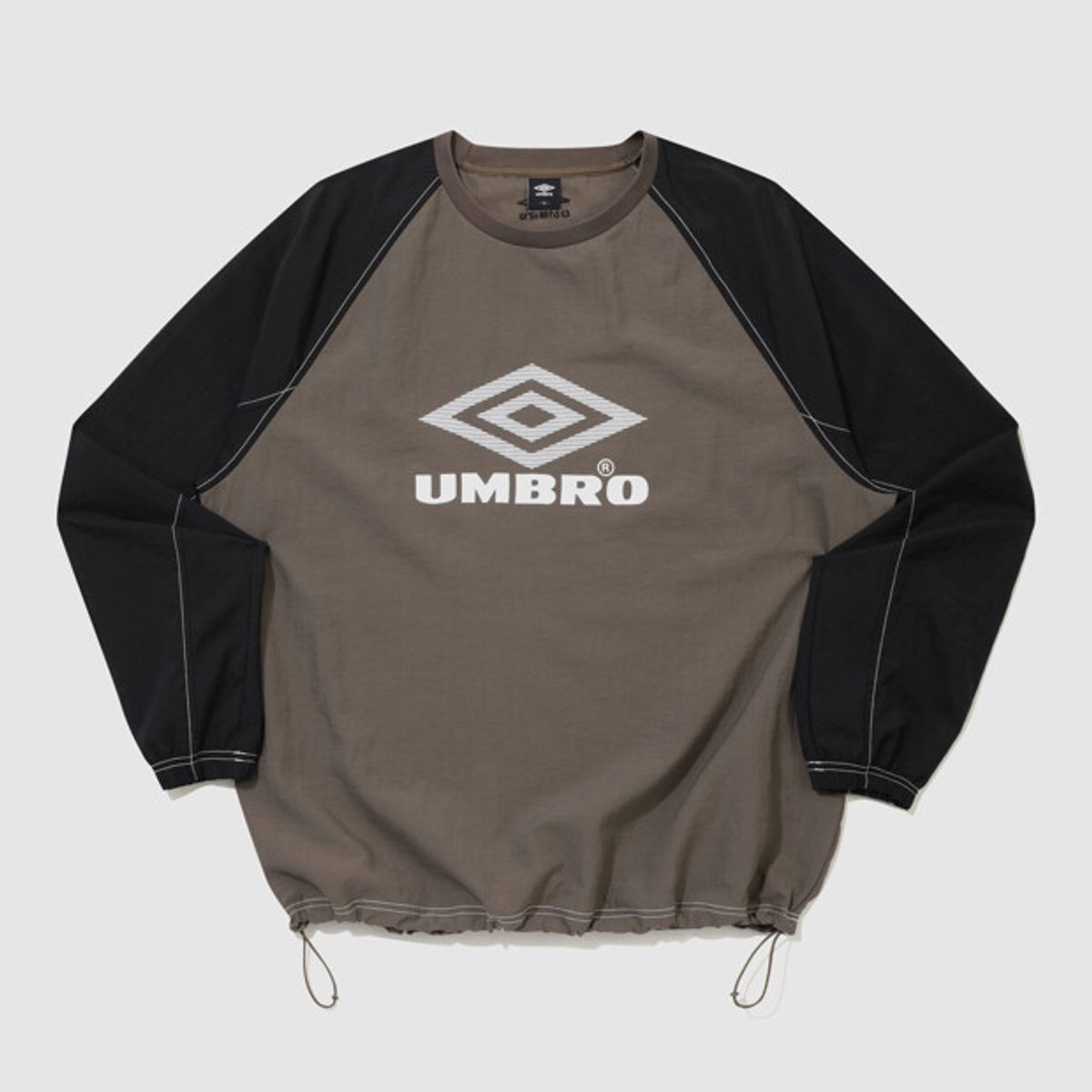 엄브로(UMBRO) 크리스피 타슬란 긴팔 피스테 브라운 UR324CWT92
