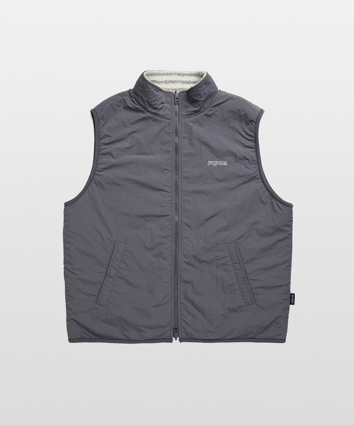 잔스포츠(JANSPORT) 로고 패턴 플리스 리버서블 베스트 IVORY