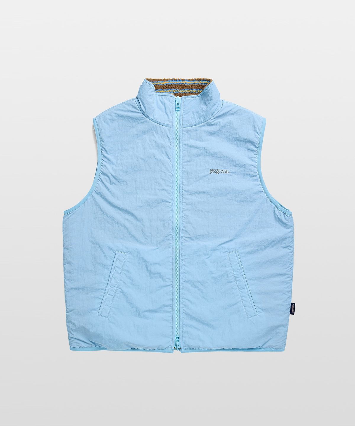 잔스포츠(JANSPORT) 로고 패턴 플리스 리버서블 베스트 BROWN