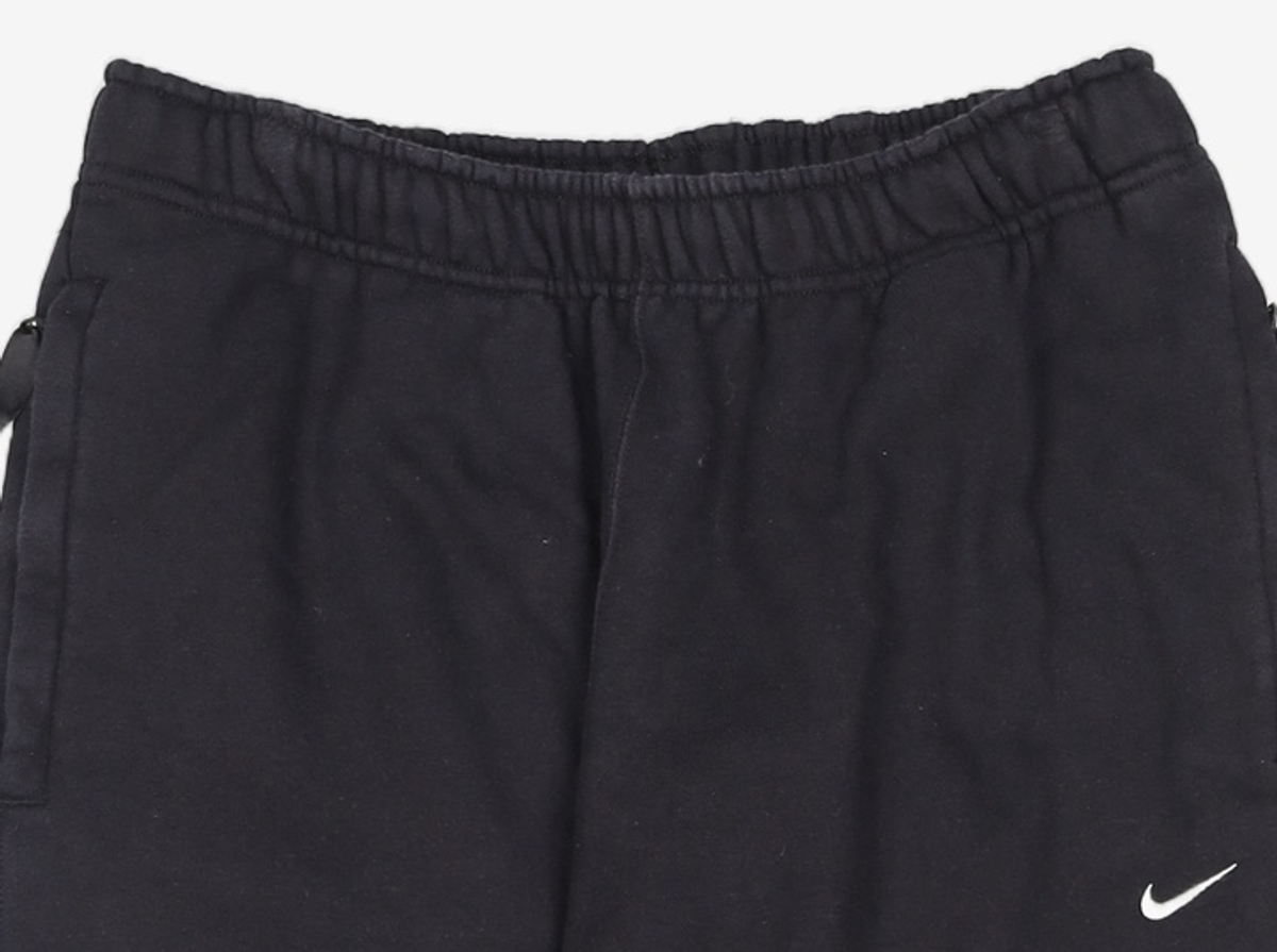 나이키(NIKE) 솔로 스우시 플리스 팬츠 M - 블랙:화이트 / DX1365-010 L