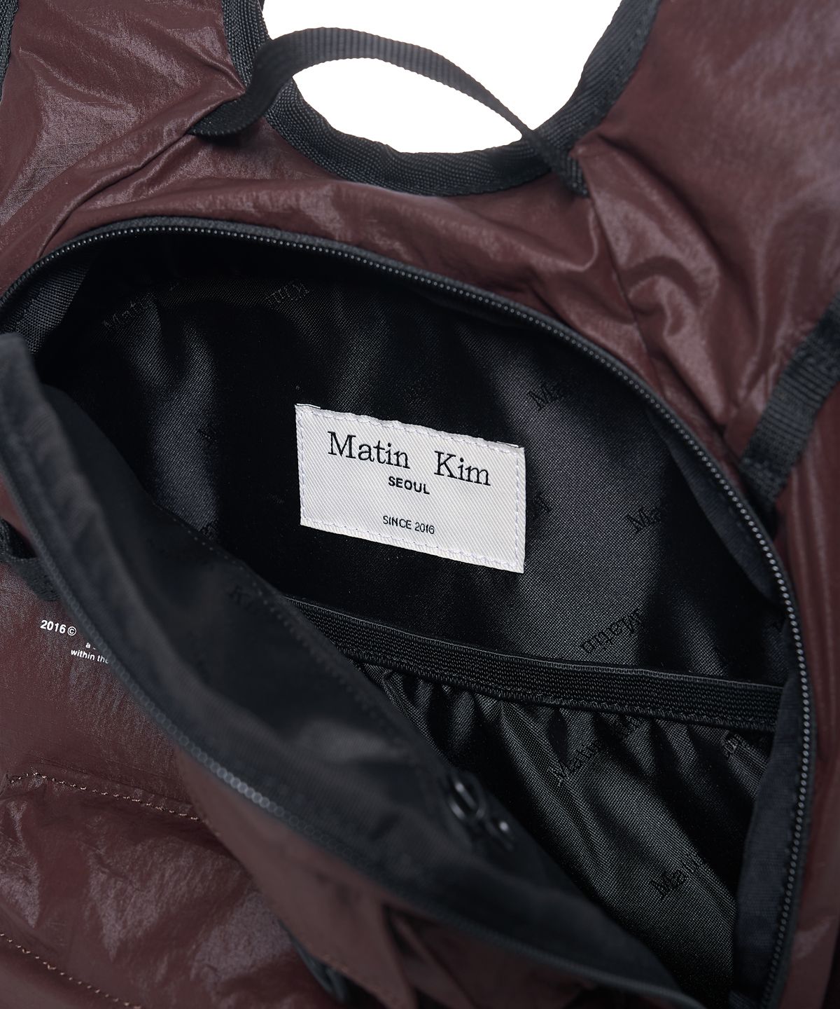 마뗑킴(MATIN KIM) MULTI-POCKET LITE MINI BACKPACK IN DARK BROWN