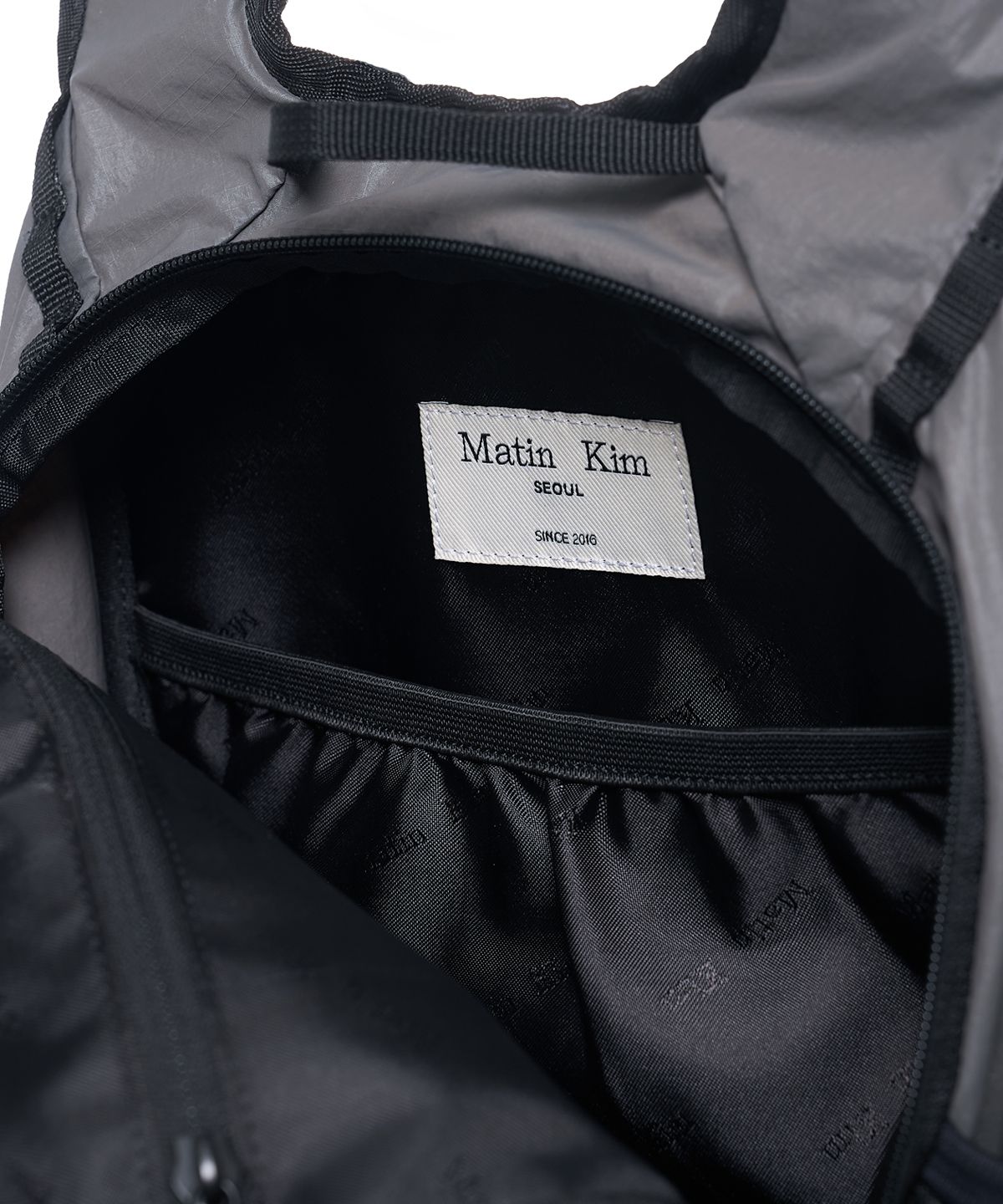 마뗑킴(MATIN KIM) MULTI-POCKET LITE MINI BACKPACK IN GREY