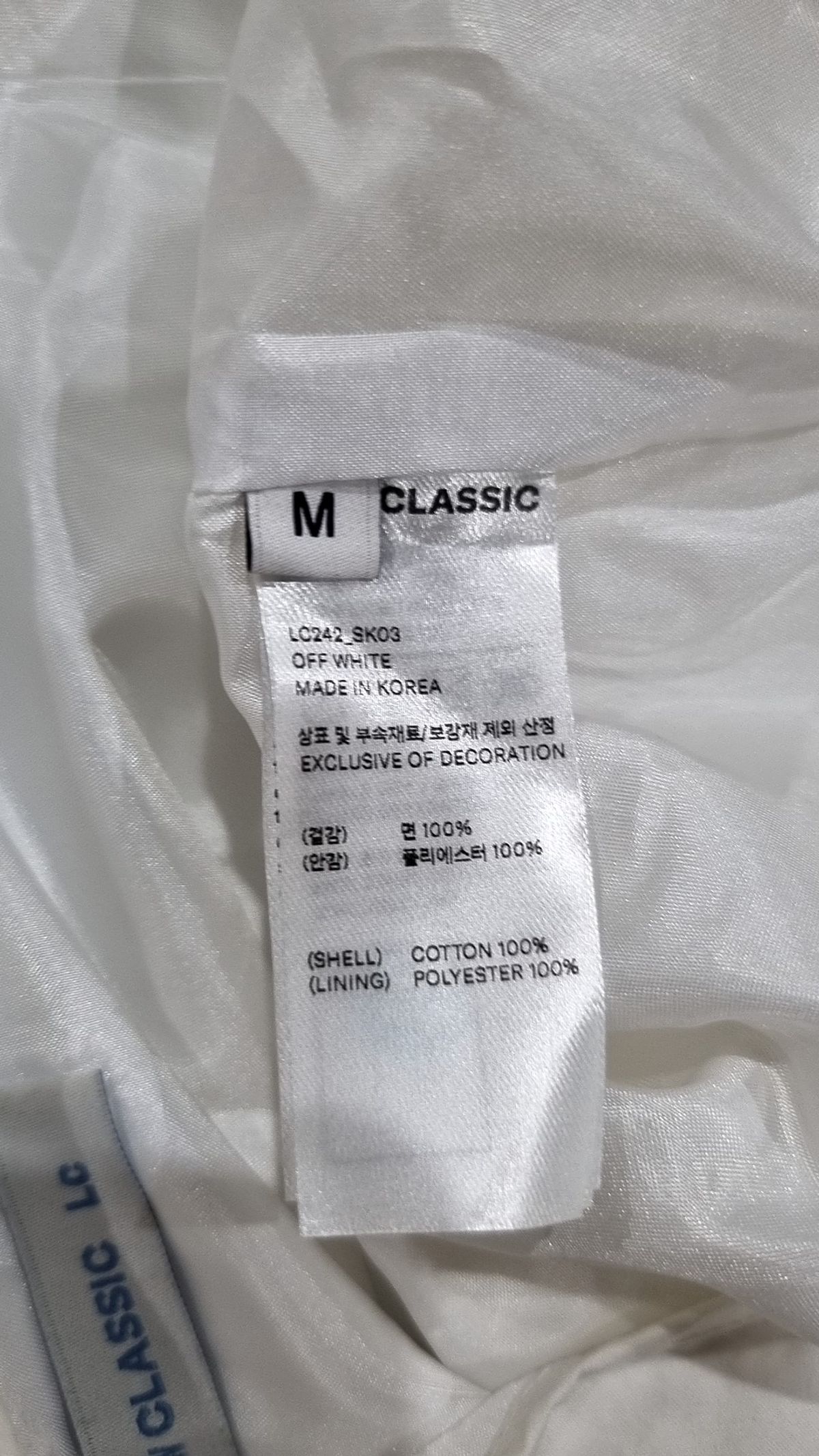 로우클래식(LOW CLASSIC) STRING MIDI SKIRT_OFF WHITE_LC242_SK03OW M