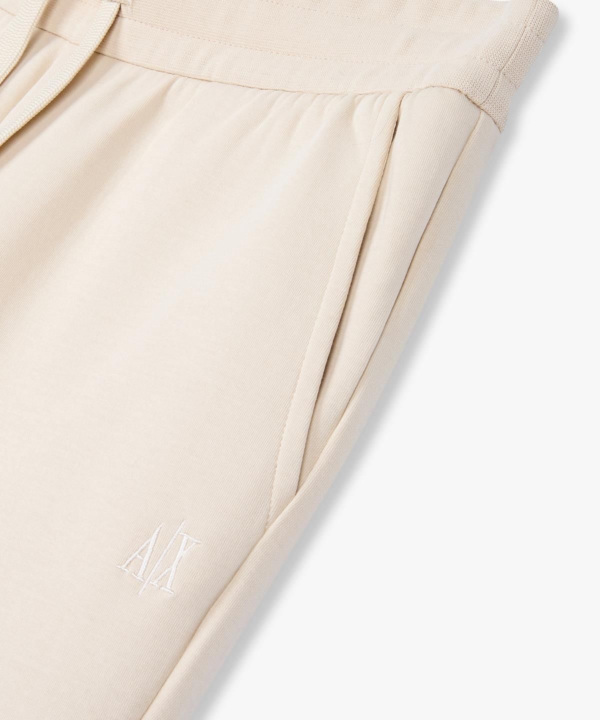아르마니 익스체인지(ARMANI EXCHANGE) 여성 자수 로고 스트레치 조거 팬츠 _베이지_A425141513