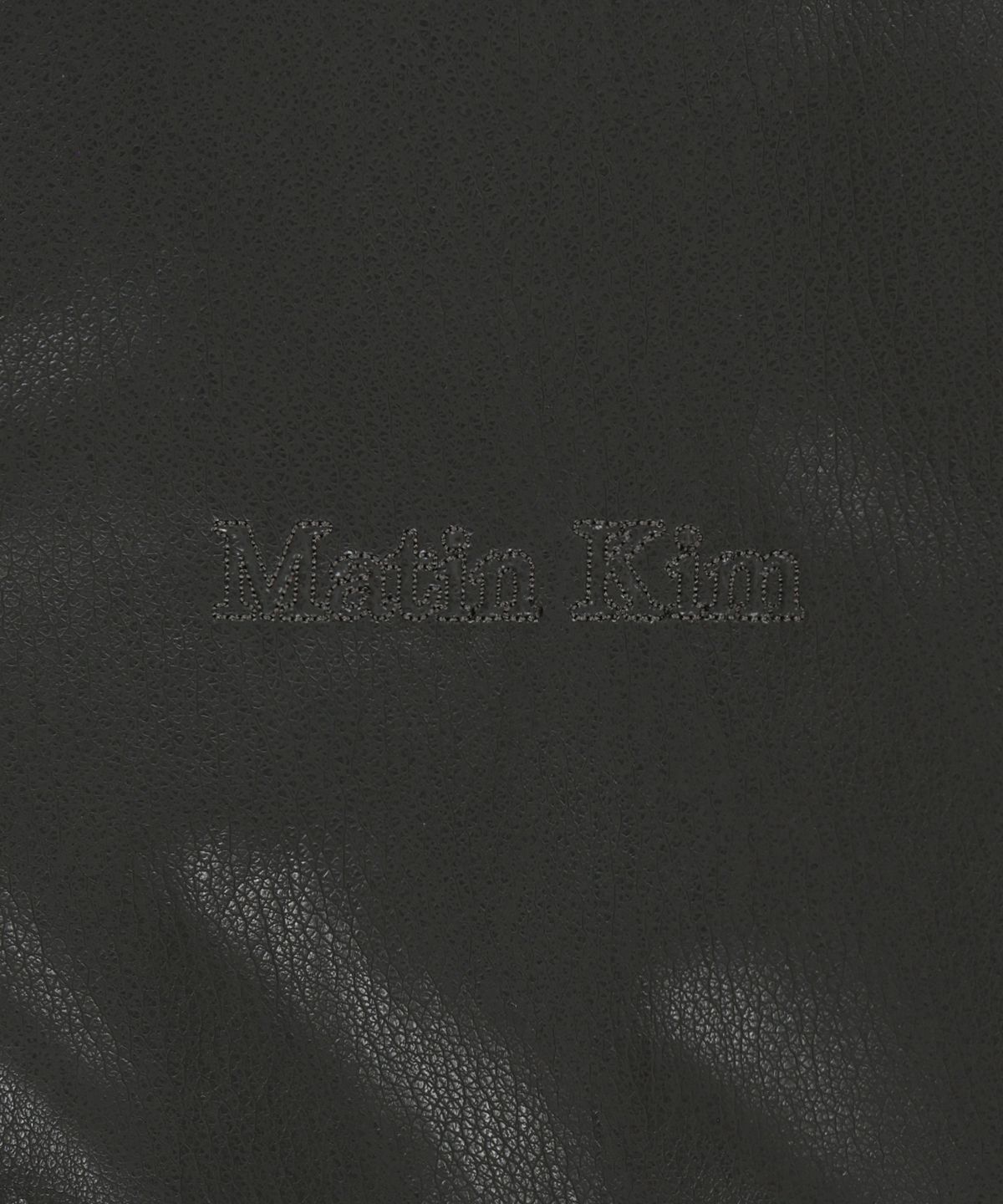 마뗑킴(MATIN KIM) SMALL LOGO FAUX LEATHER HIGH NECK JUMPER IN DARK BROWN
