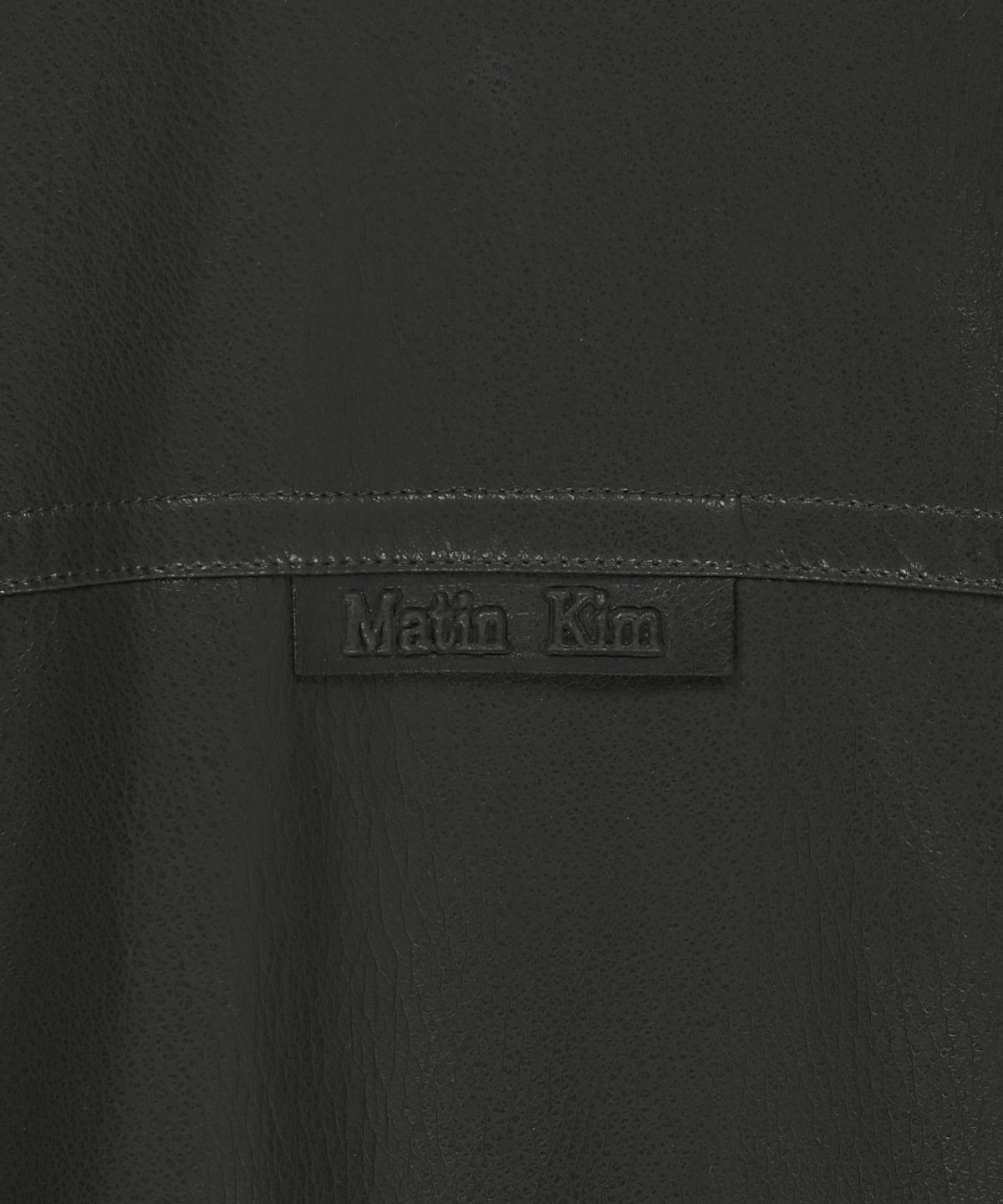마뗑킴(MATIN KIM) SMALL LOGO FAUX LEATHER HIGH NECK JUMPER IN DARK BROWN