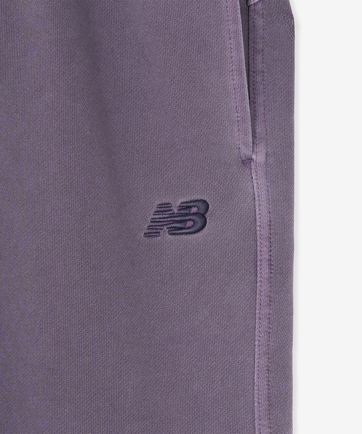 뉴발란스(NEW BALANCE) NBNVG31843 / UNI ESCAPE 8부 다잉 버뮤다 스웻쇼츠 (PURPLE)