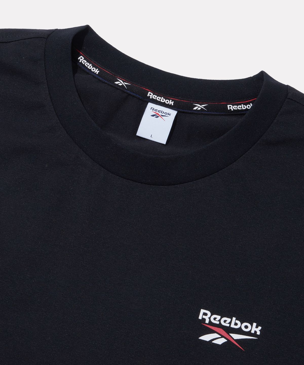 리복(REEBOK) 빅벡터 슬로건 프레쉬 반팔티 - 블랙