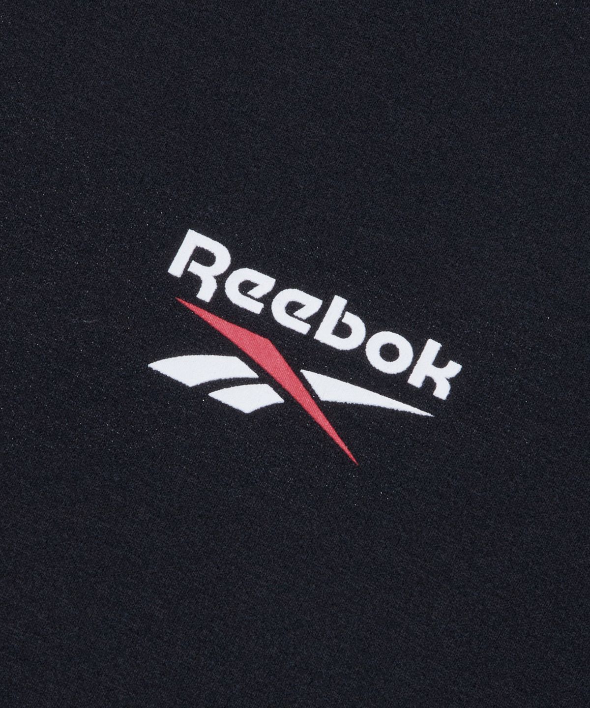 리복(REEBOK) 빅벡터 슬로건 프레쉬 반팔티 - 블랙