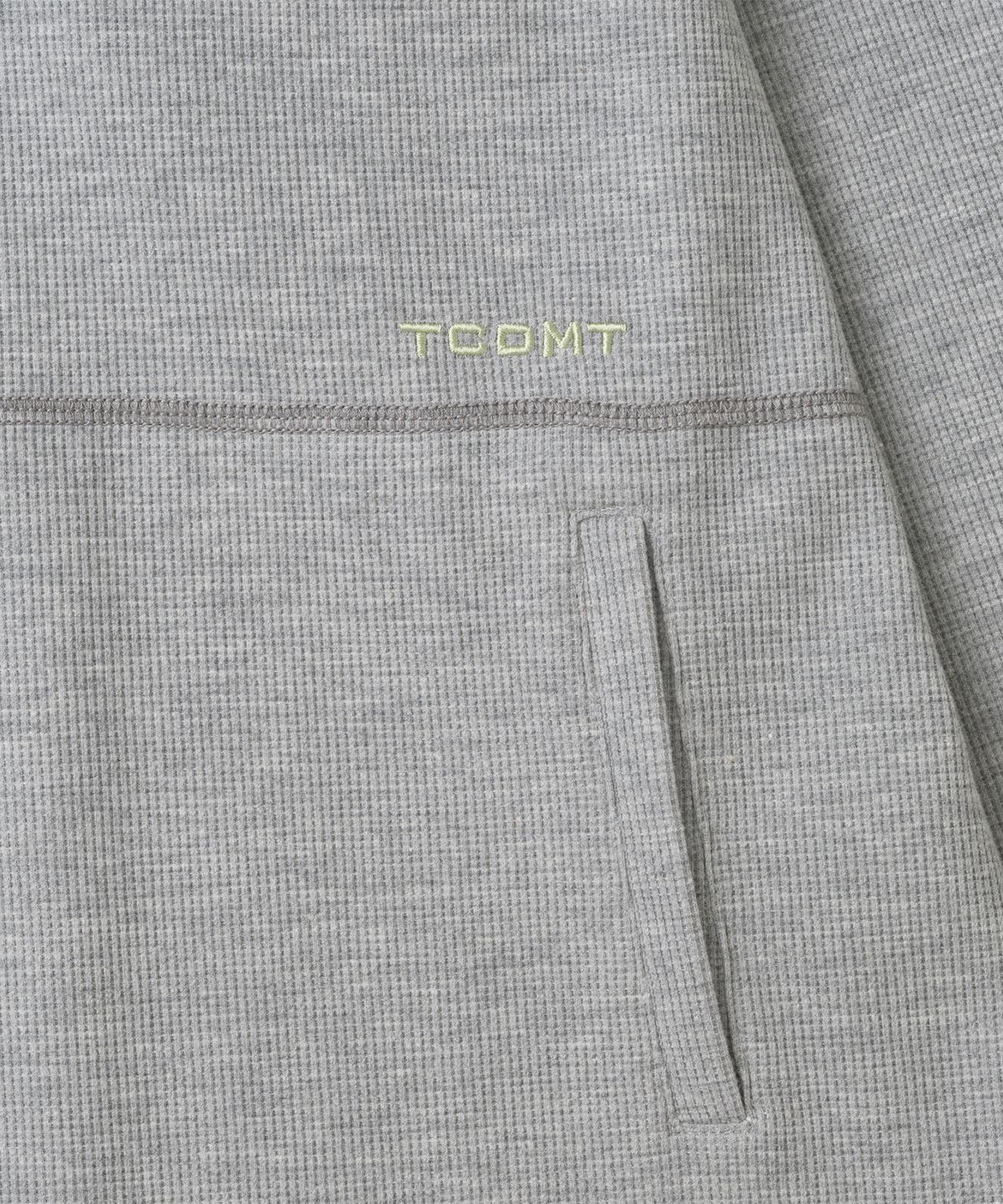 더콜디스트모먼트(THE COLDEST MOMENT) TCM stitch cross hooded long sleeve (melange grey)