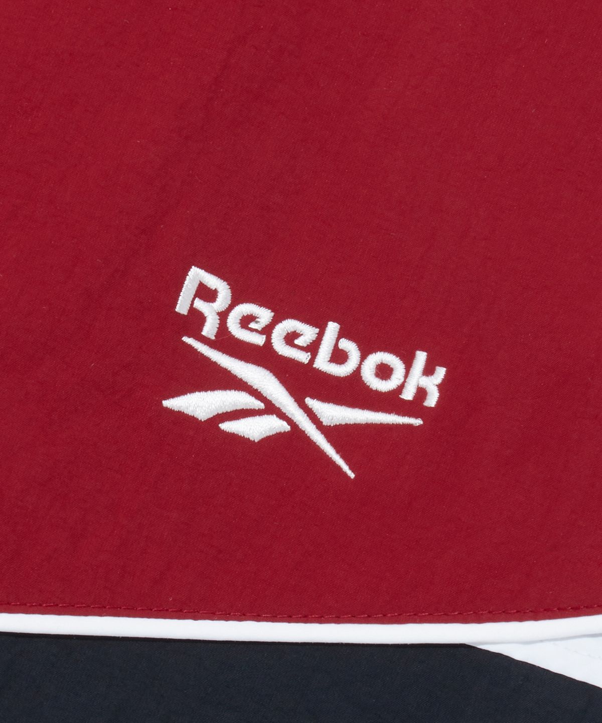 리복(REEBOK) 헤리티지 윈드 브레이커 v26 - 다크 레드:차콜
