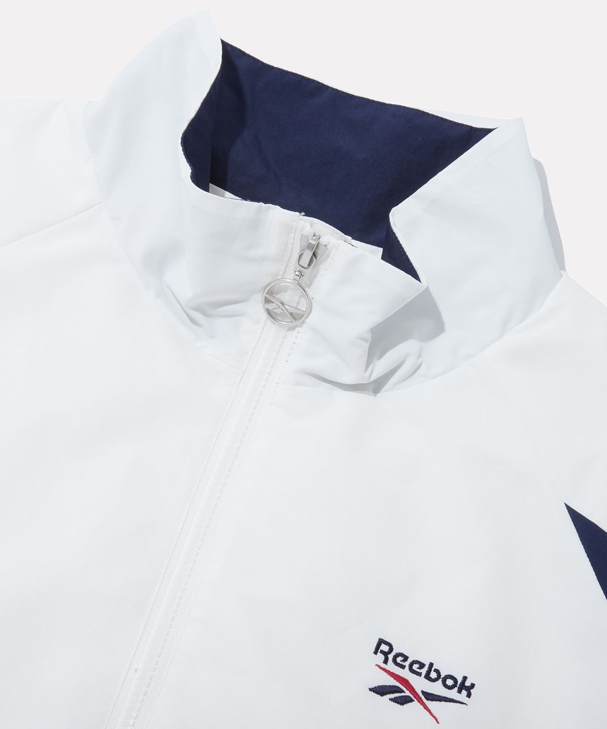 리복(REEBOK) DNA 트랙 윈드 브레이커 - 오프 화이트