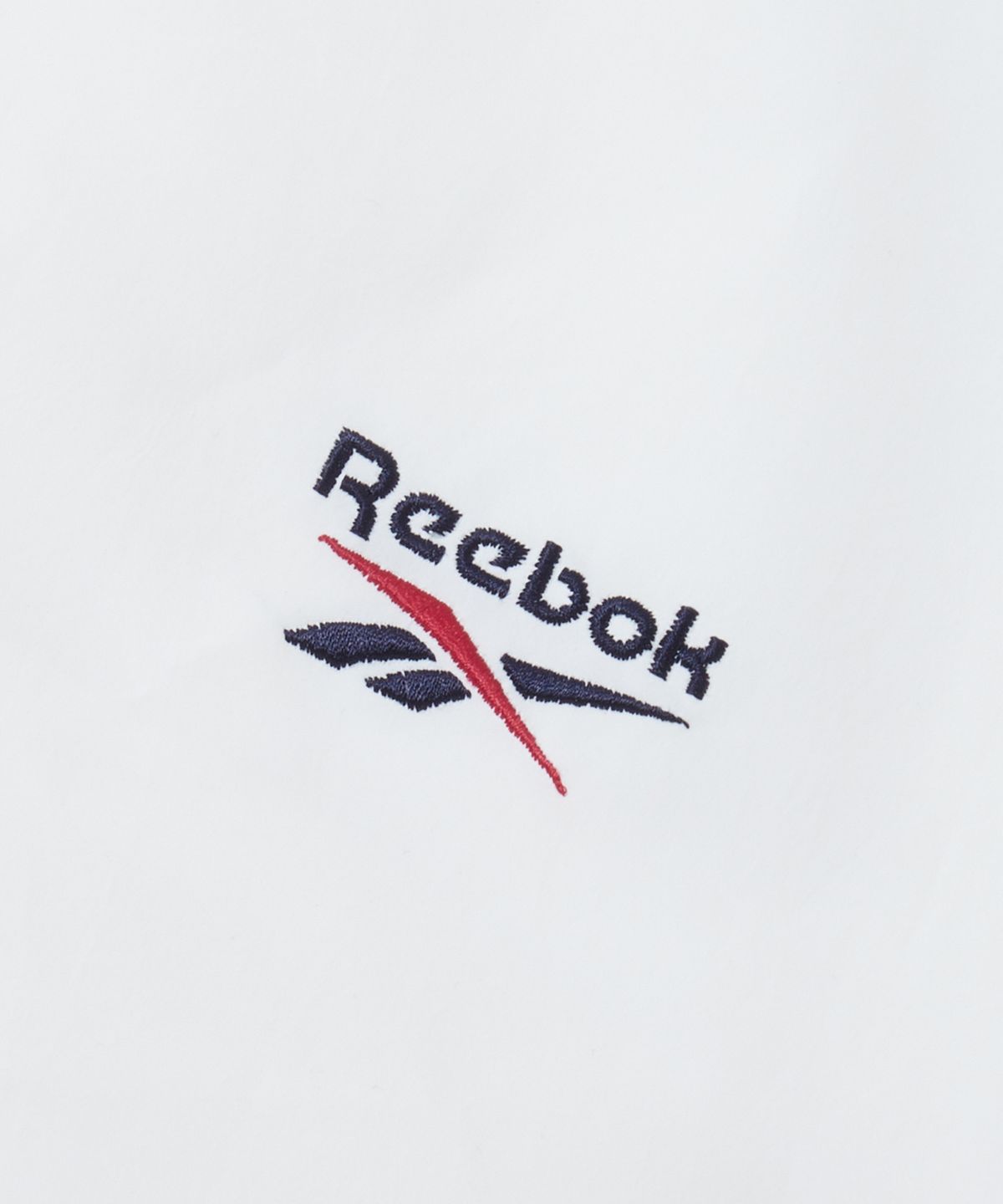 리복(REEBOK) DNA 트랙 윈드 브레이커 - 오프 화이트