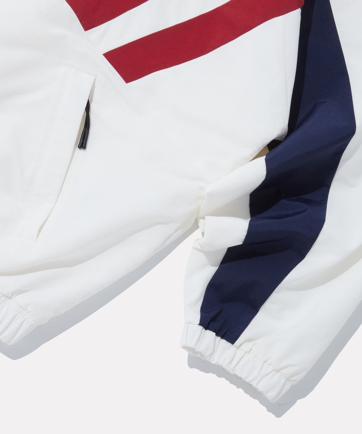 리복(REEBOK) DNA 트랙 윈드 브레이커 - 오프 화이트