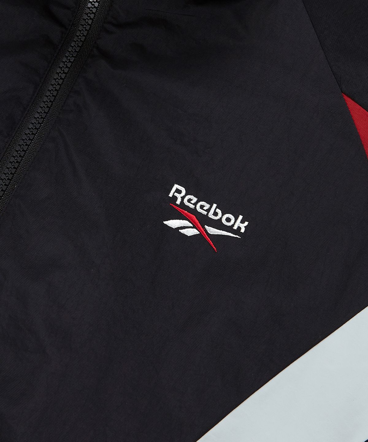 리복(REEBOK) DNA 트랙 윈드 브레이커 - 블랙